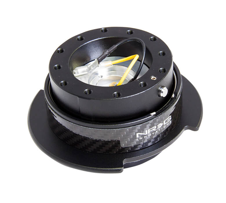 NRG Quick Release Kit SRK-250CF featuring a sleek black body with a carbon fiber ring, Gen 2.5, highlighting its sophisticated design and superior craftsmanship.