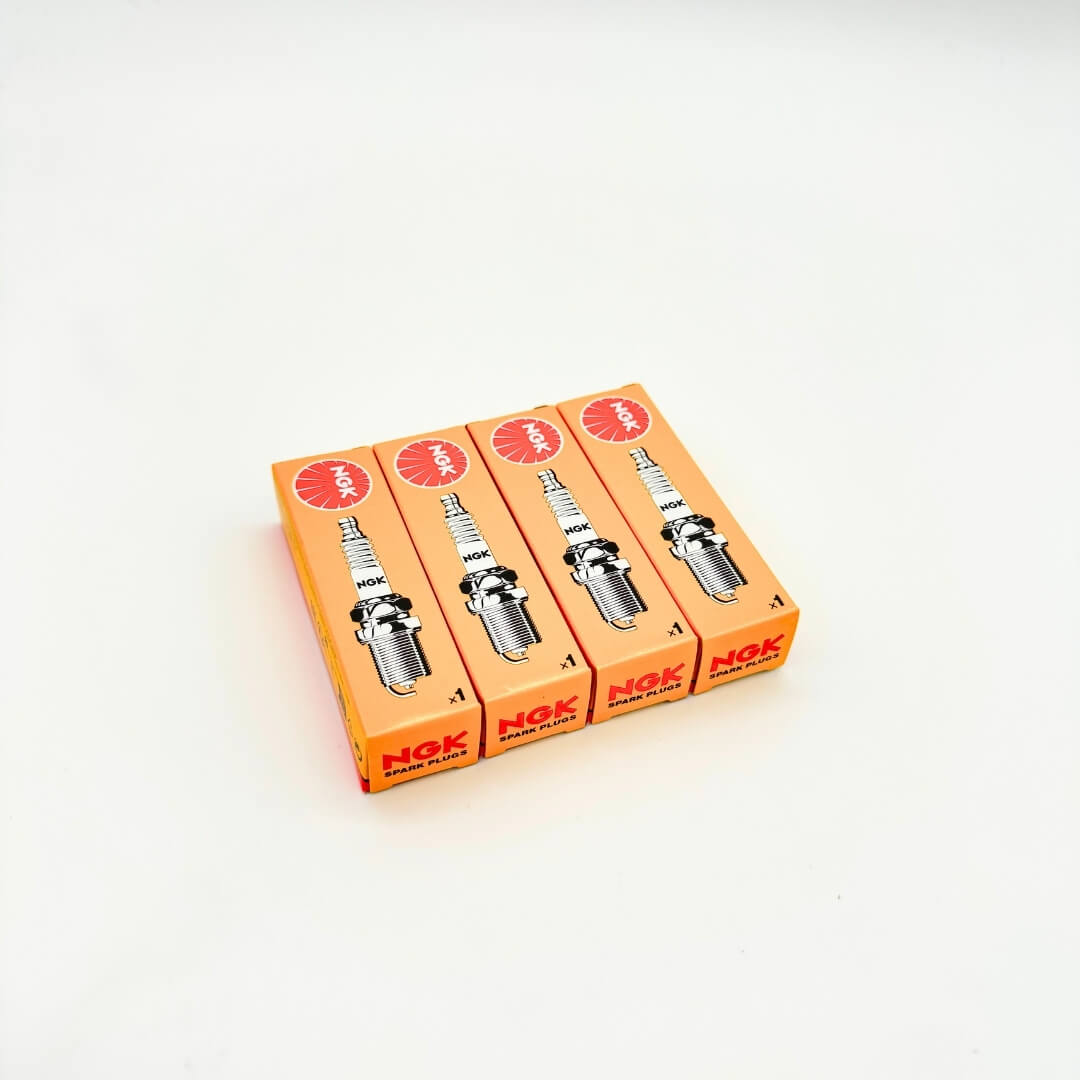 Box of four NGK spark plugs for Subaru Sambar KV3, KV4 1990-1998, showing brand and product graphics.