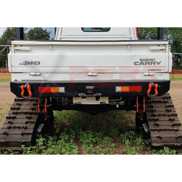 Suzuki Carry rear bumper with LED tow bar, black, for DB52T model truck, 1999-2002, featuring orange tow hooks and track wheels.