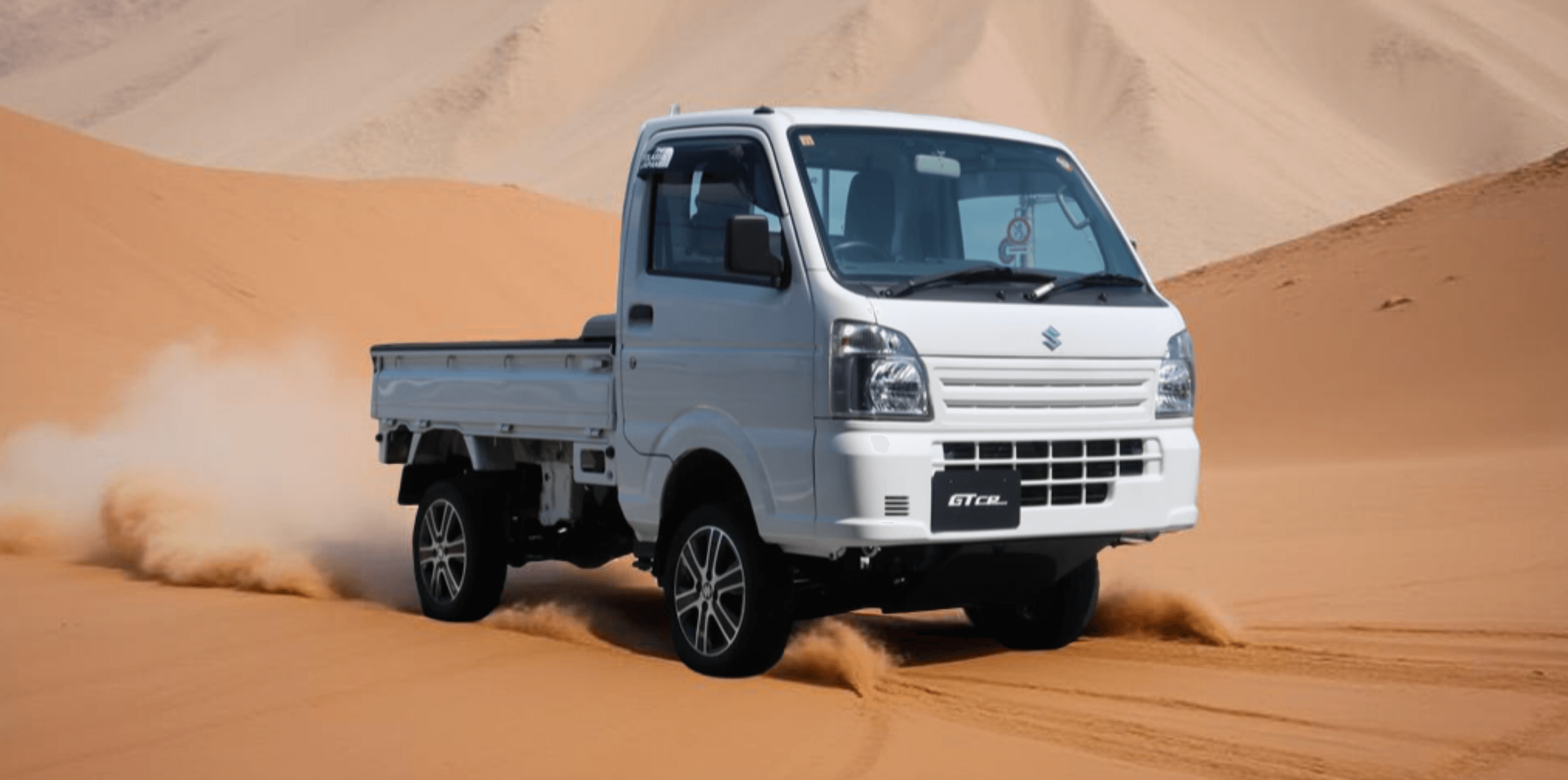 White Suzuki Carry Truck DA16T (2013-Present) Kei Truck Off-Roading on Sand Dunes – Premium Performance Parts & Accessories for Modern Mini Trucks