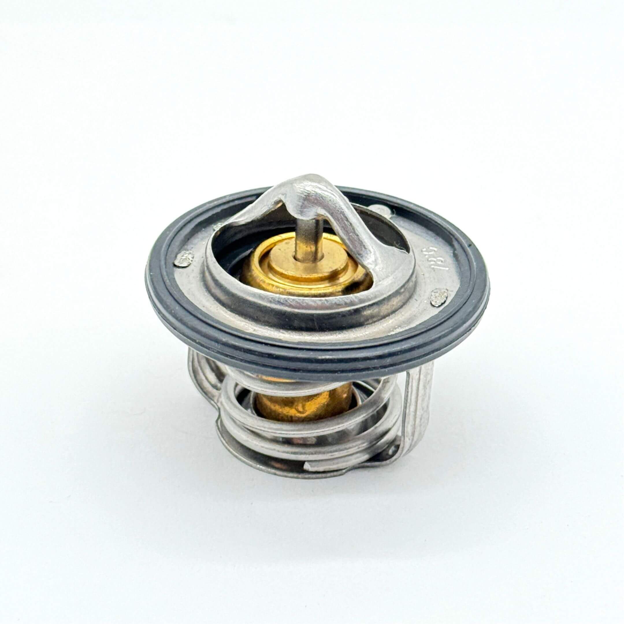 Aftermarket thermostat for Subaru Sambar Truck TT1, TT2 models (1999-2012), featuring a durable metal construction with a silver and brass finish.