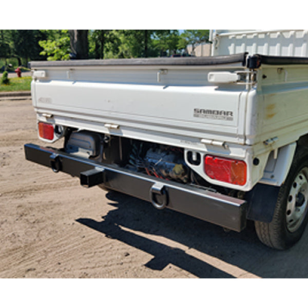 Subaru Sambar rear tow bumper without engine cover for TT2 model, 1999-2012, featuring a durable black finish.