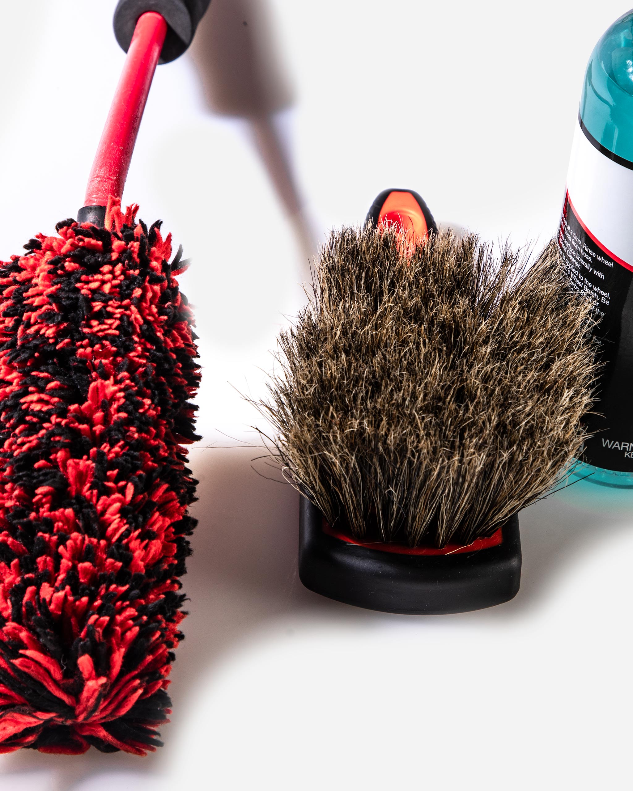 Close-up of boar’s hair wheel brush and wheel woolie from the Best Wheel Cleaner Basic Kit by Adam’s Polishes, ideal for delicate and aftermarket wheels.