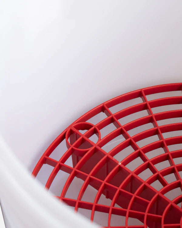 Best Car Wash Kit with a red grit guard from Adam’s Polishes, designed to trap dirt and prevent swirl marks in a 2-bucket washing system.