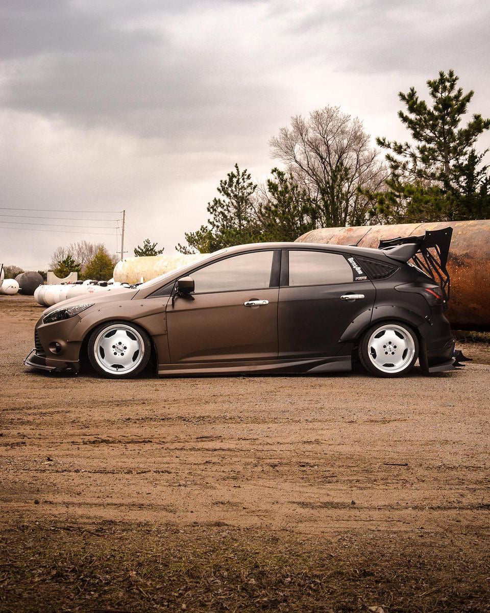 Side View of a Car with Omnique Rhyolite Bronze Window Tint – Stylish Brown Mirror Look