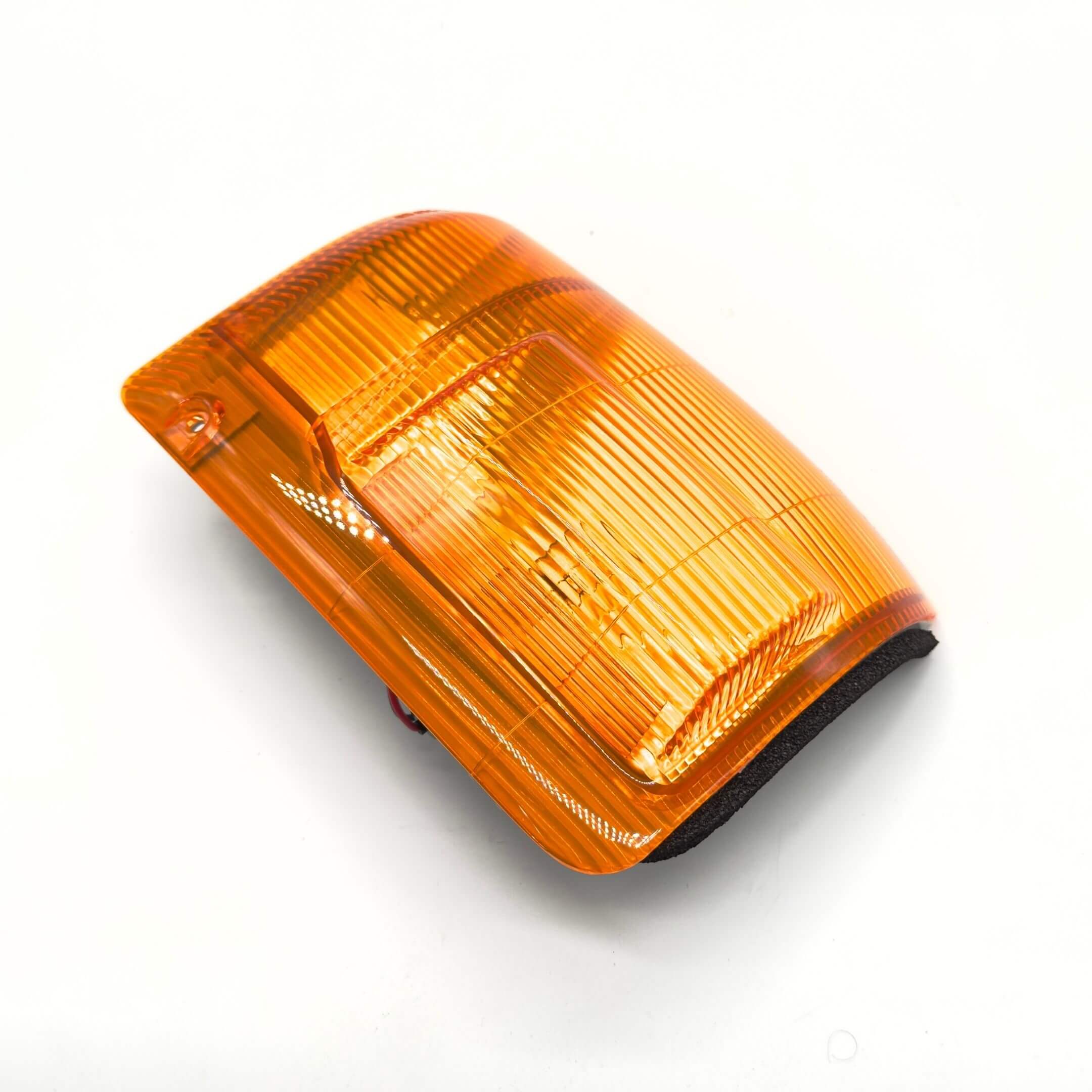Front Turn Lamp Assembly for Subaru Sambar Truck TT1, TT2 Models (1999-2012) featuring an amber lens and passenger side fitment.