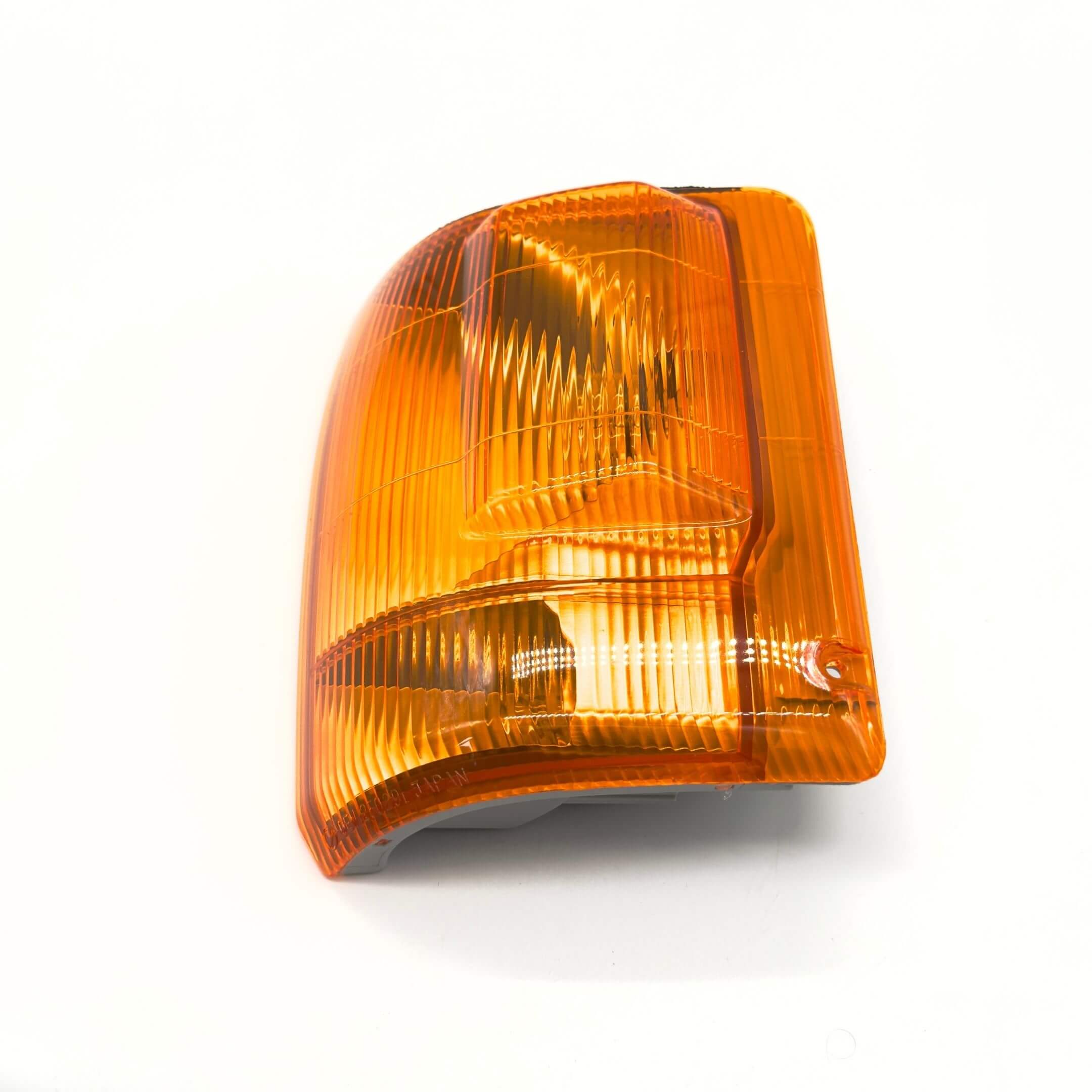 Front Turn Lamp Assembly for Subaru Sambar Truck TT1, TT2 Models (1999-2012) featuring an amber lens and passenger side fitment.