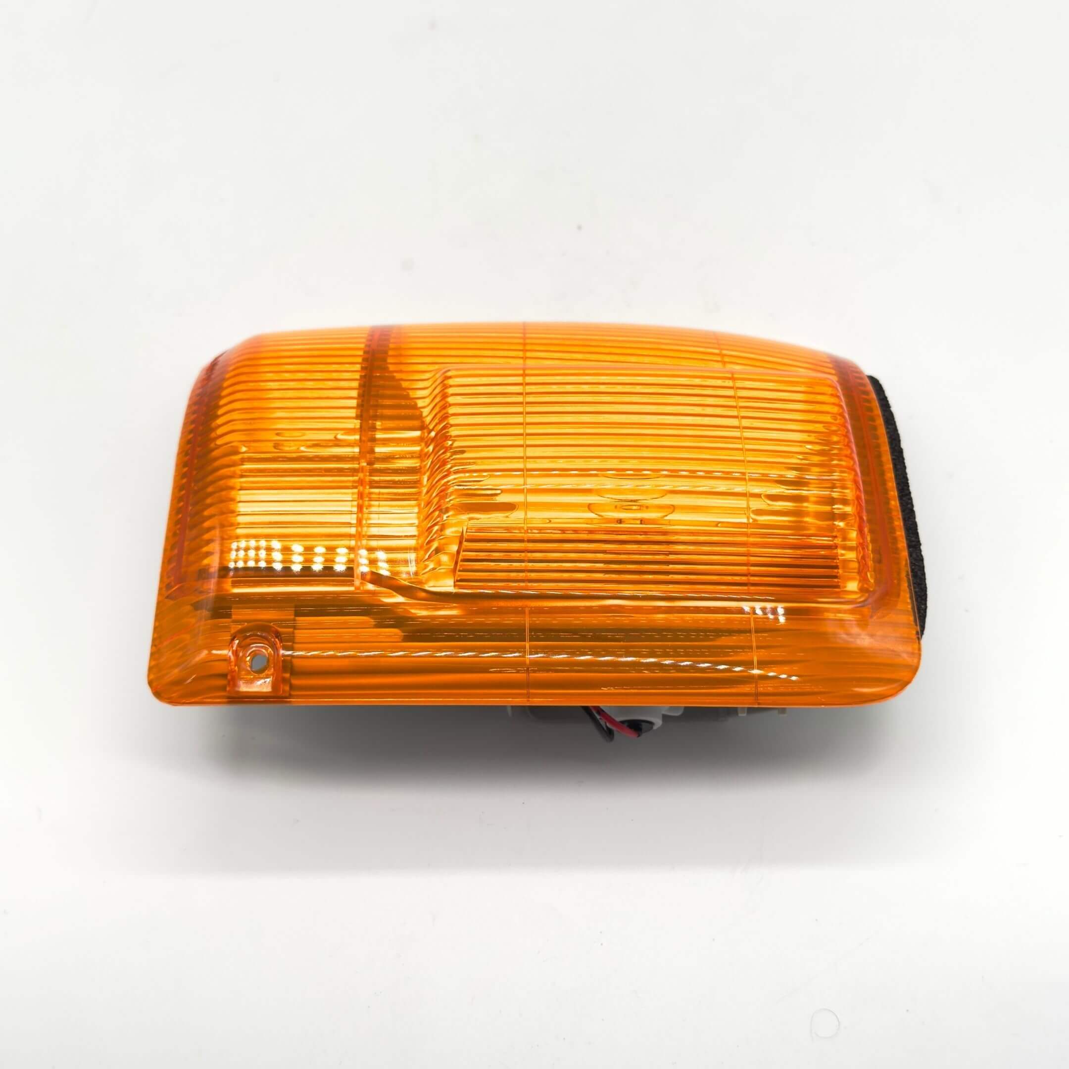 Front Turn Lamp Assembly - Left / Passenger Side for Subaru Sambar Truck TT1, TT2 Models (1999-2012) featuring an amber lens and wiring connections.
