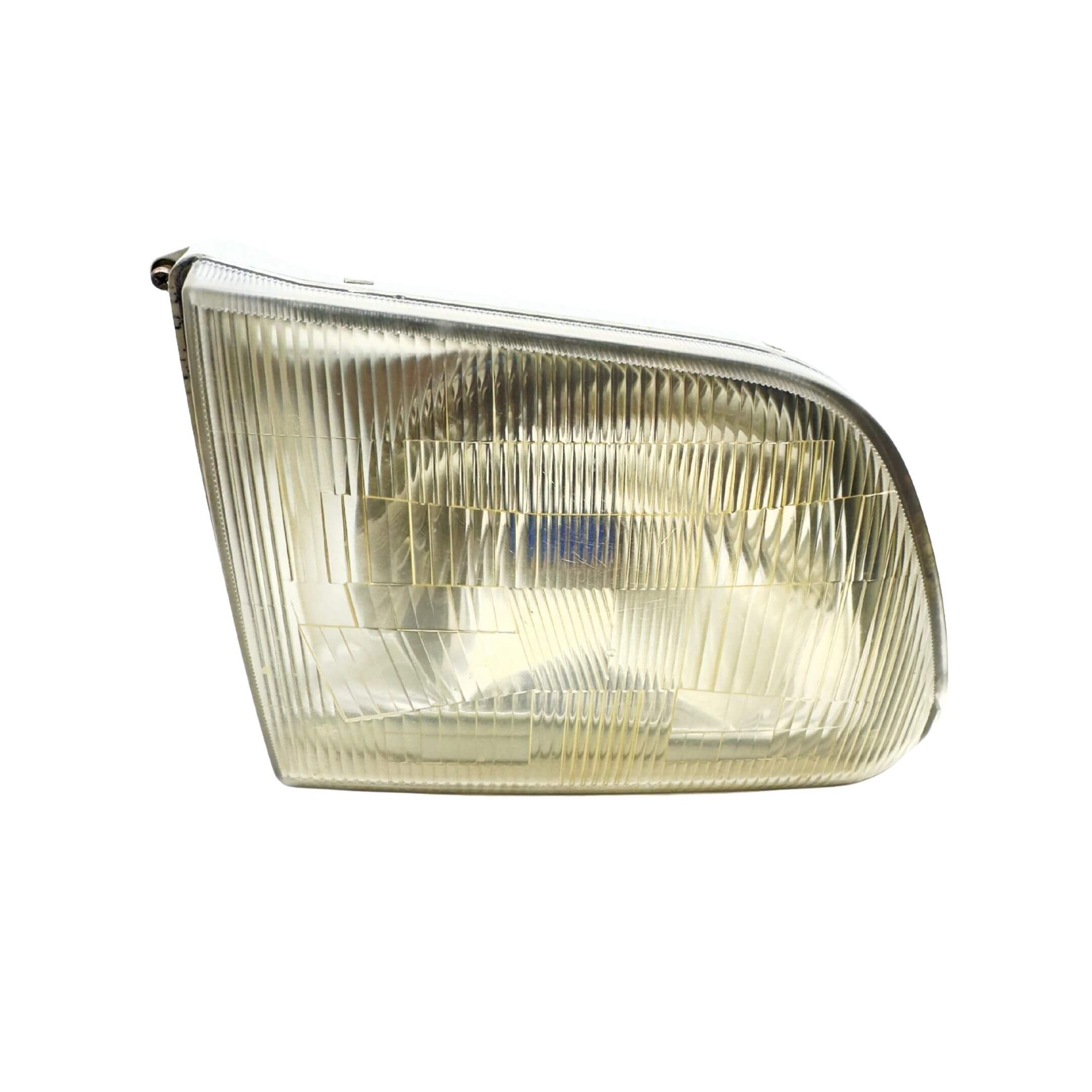 Used right driver side headlight for Subaru Sambar Truck TT1, TT2 models (2002-2012) featuring a clear, ribbed lens design.