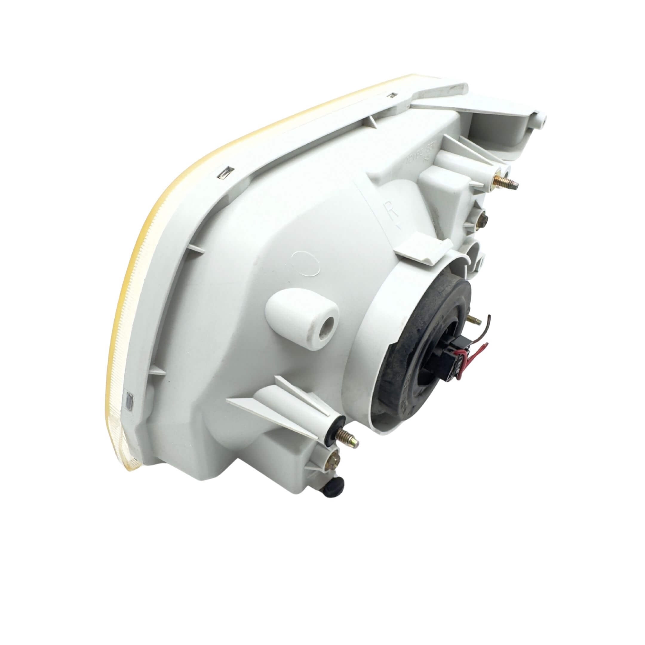 Used right driver side headlight for Subaru Sambar Truck TT1, TT2 models (2002-2012) featuring a white housing and visible wiring connections.