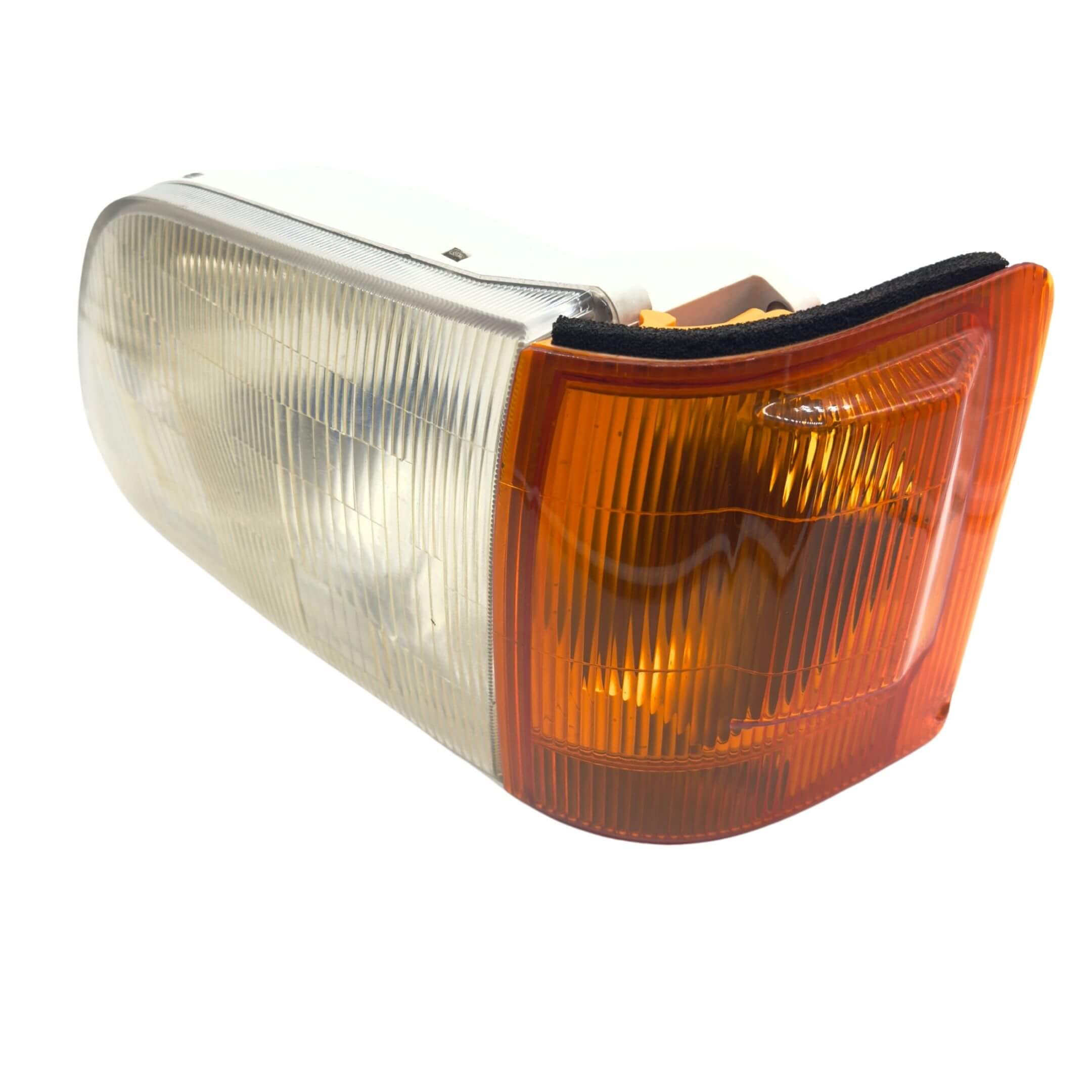 Headlight and Turn Signal Assembly for Subaru Sambar Wagon TW1, TW2 Models (1999-2012) featuring a clear lens with an amber turn signal section.