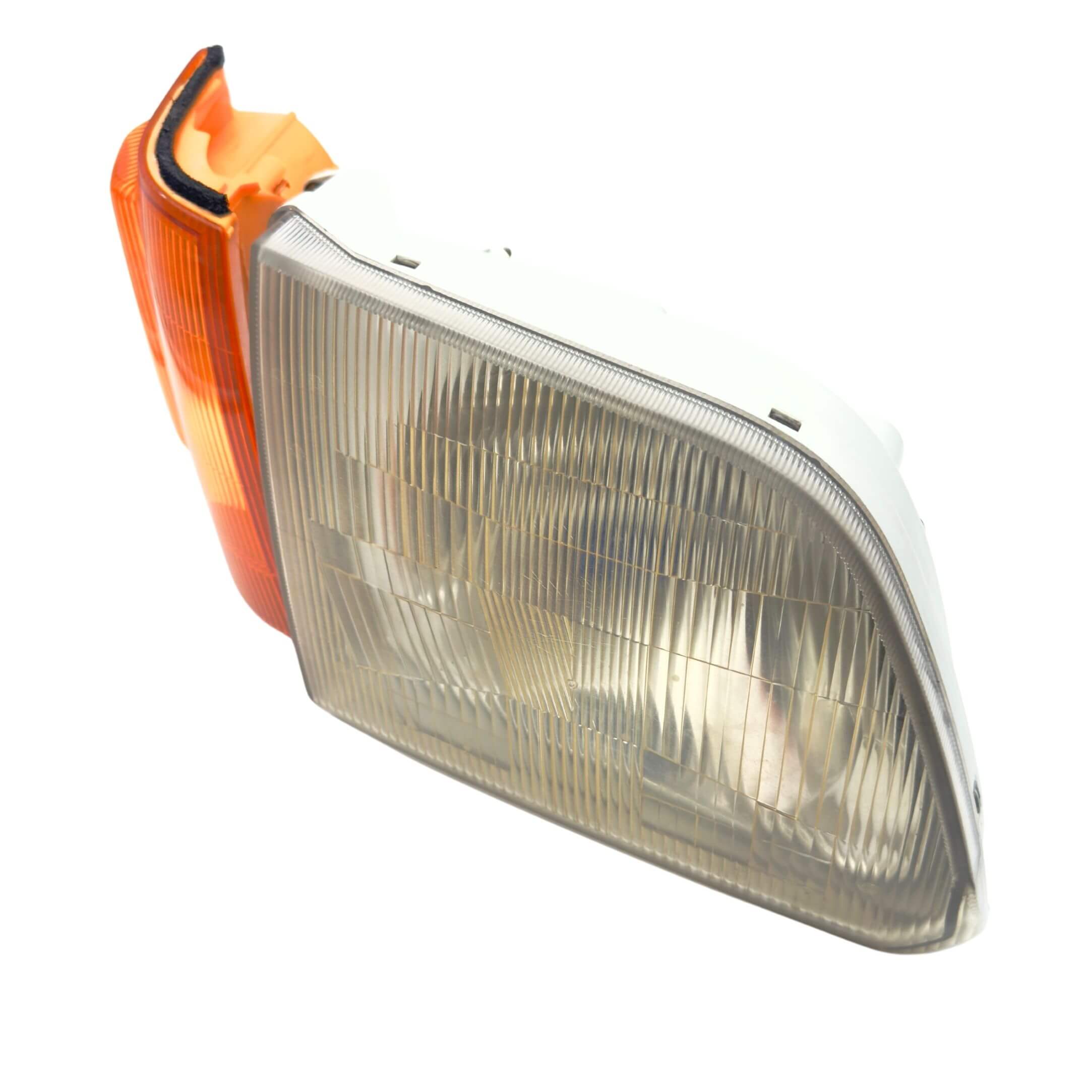 Headlight and Turn Signal Assembly for Subaru Sambar Wagon TW1, TW2 Models (1999-2012), featuring a clear lens and amber turn signal on the right/driver side.