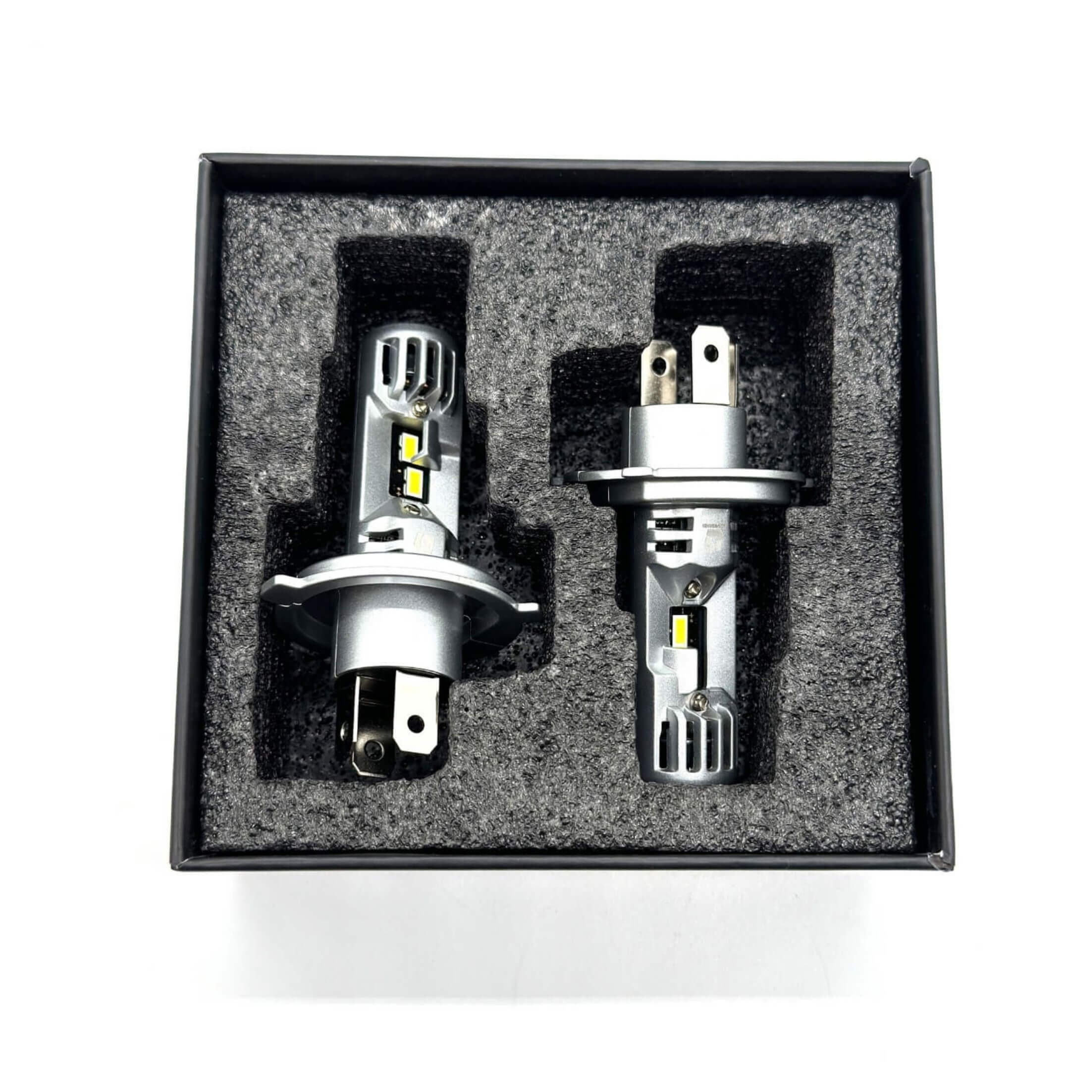 LED Headlight Bulbs for Subaru Sambar Van TV1, TV2 Models (1999-2012) featuring dual-prong connectors and compact design in a foam-lined box.