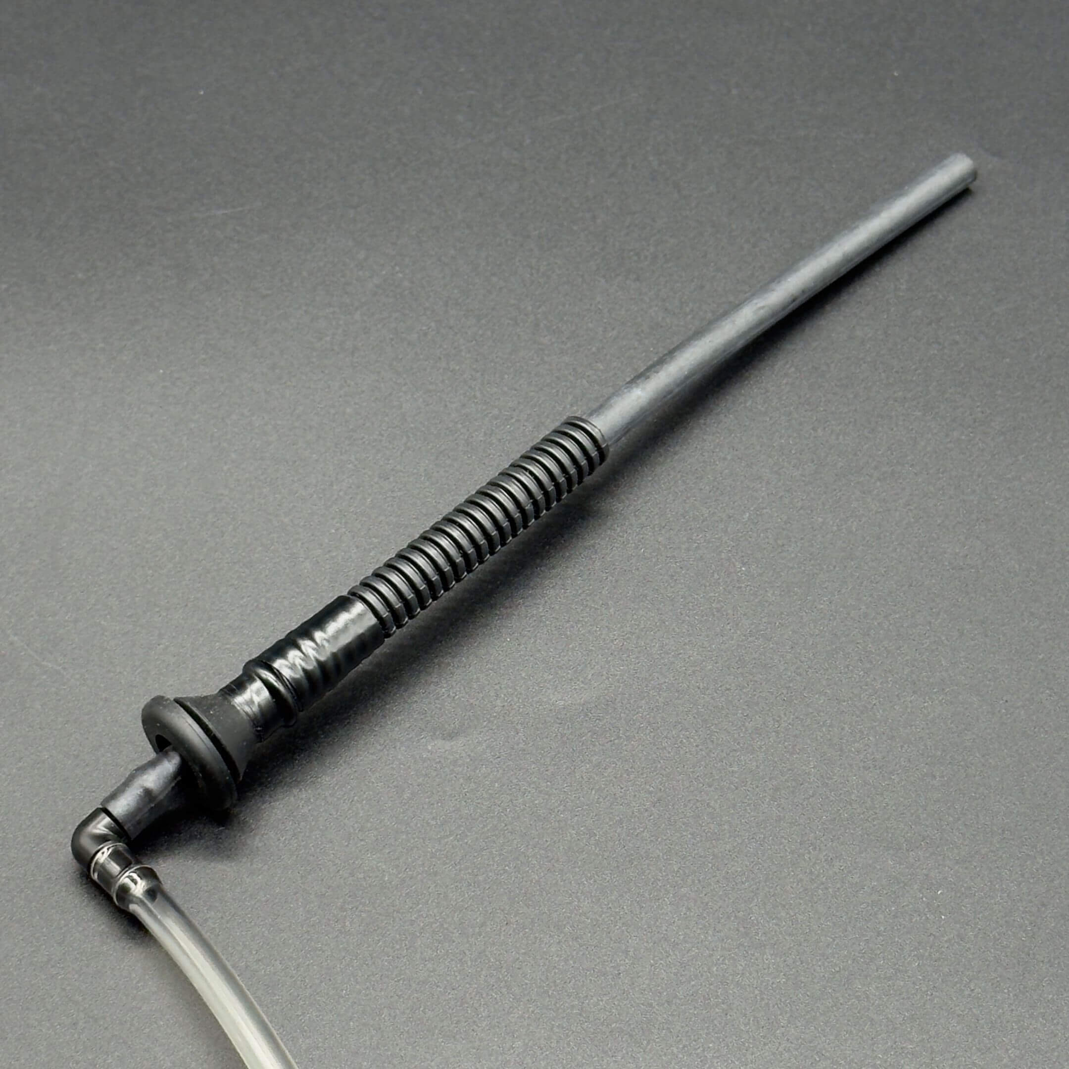 Windshield Reservoir Tank Assembly with Pump for Subaru Sambar Wagon TW1, TW2 Models (1999-2012) featuring a long, black, ribbed tube with a connected clear hose.