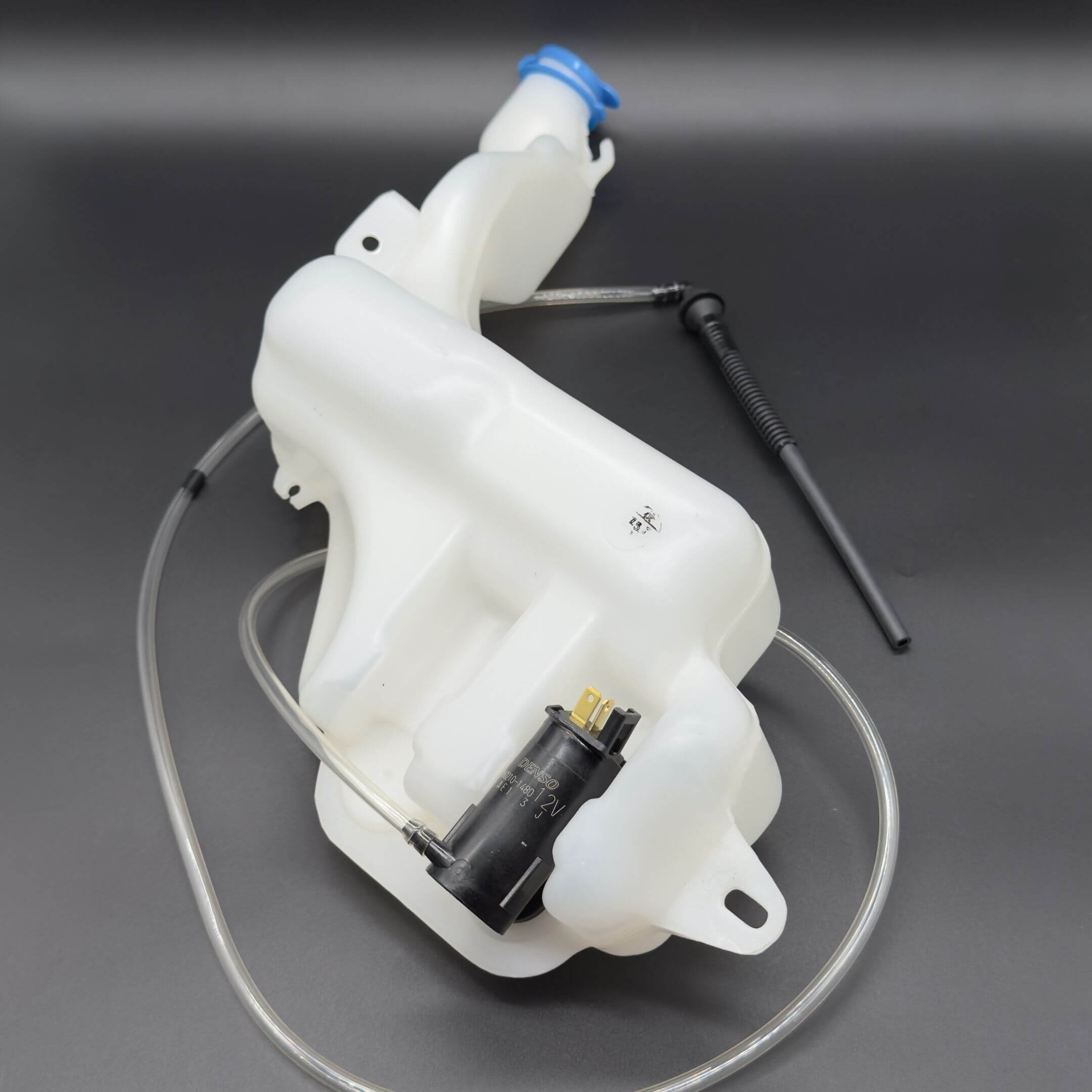 Windshield Reservoir Tank Assembly with Pump for Subaru Sambar Van TV1, TV2 Models (1999-2012) featuring a white tank, black pump, and clear tubing.