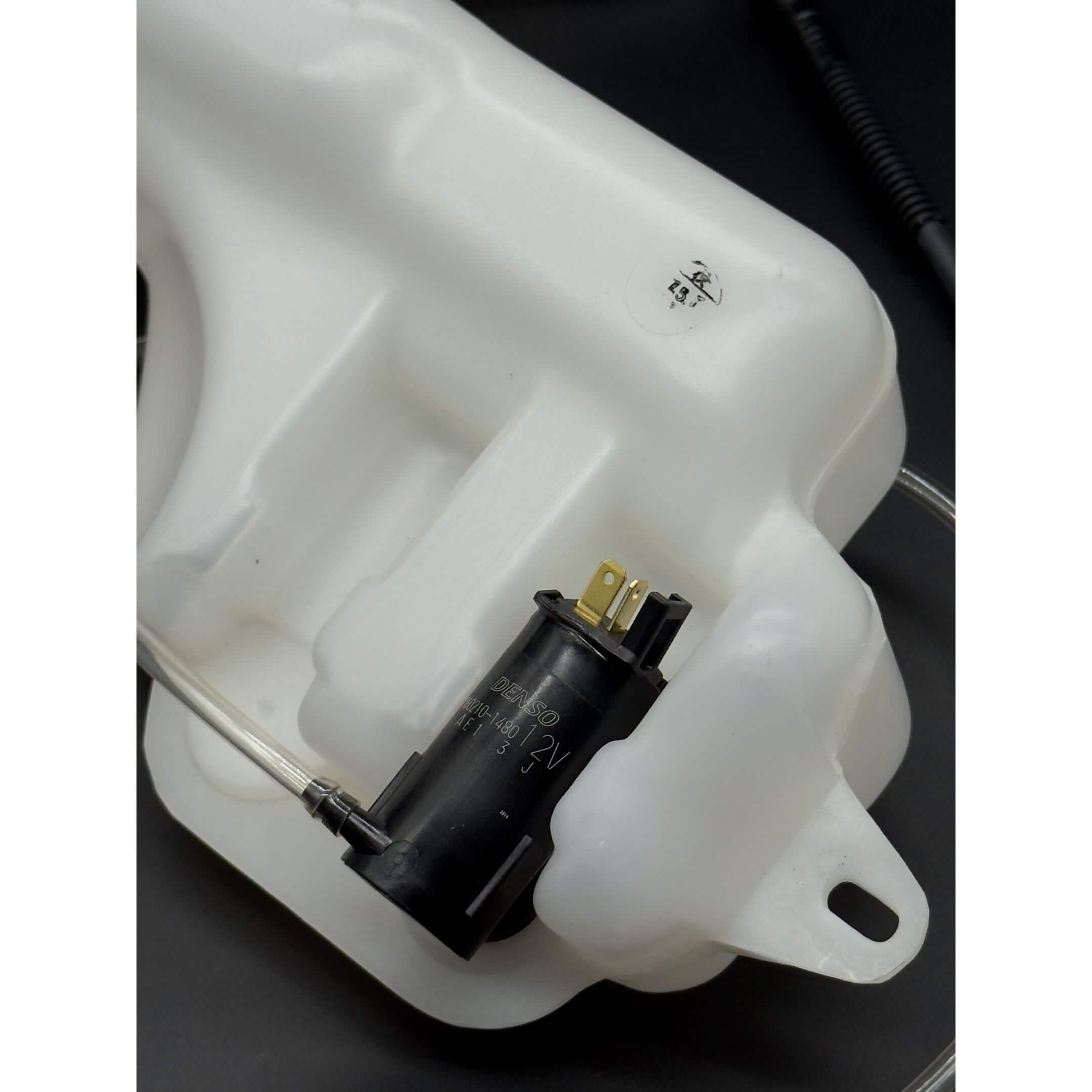 Windshield Reservoir Tank Assembly with Pump for Subaru Sambar Wagon TW1, TW2 Models (1999-2012) featuring a durable white plastic body and integrated black pump.