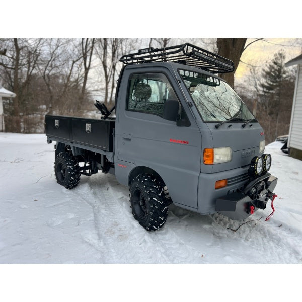 Suzuki Carry DD51T 1991-1999 with gray front bumper featuring a 2” receiver, Type A design, parked in a snowy setting.