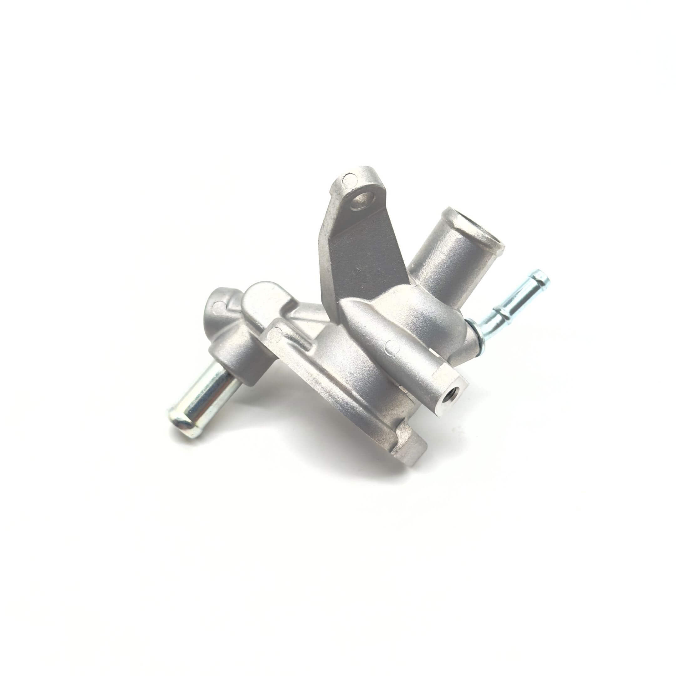 Thermostat Housing Body - Part A for Subaru Sambar Wagon TW1, TW2 Models (1999-2012) featuring a metallic finish and multiple hose connections.