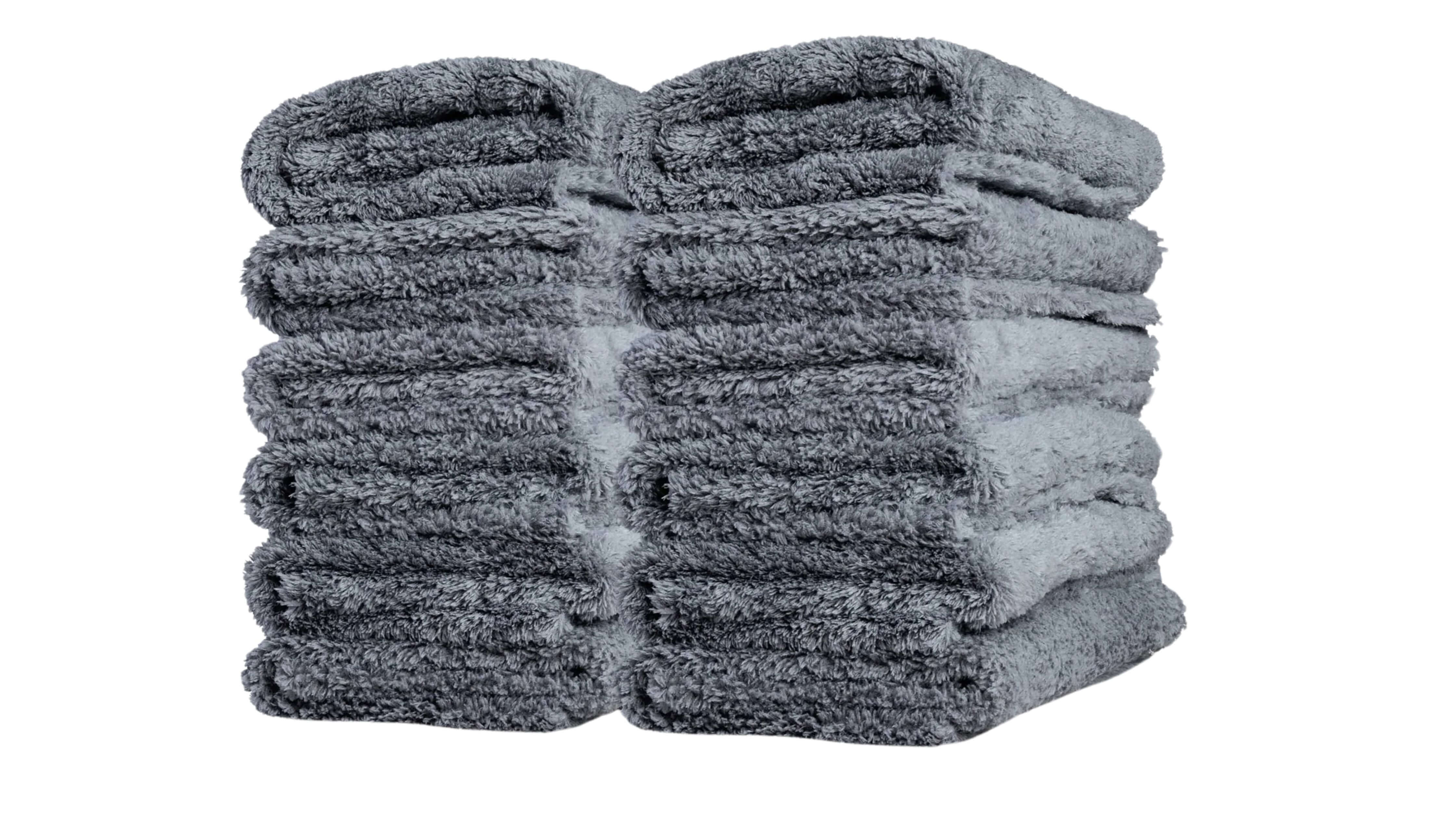 Two stacks of folded gray microfiber towels, perfect for car detailing.