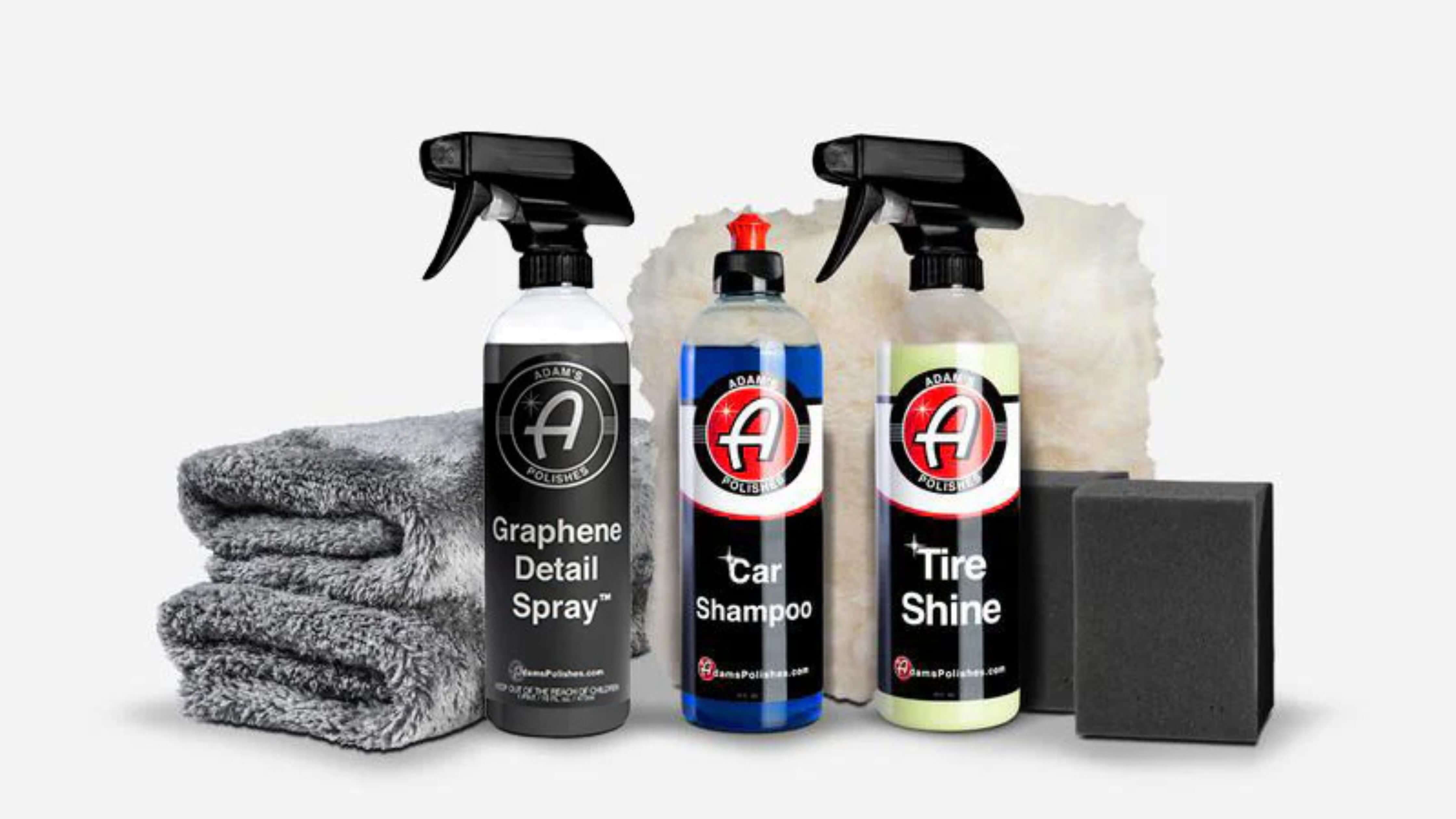 A set of car cleaning products including Graphene Detail Spray, Car Shampoo, Tire Shine, microfiber towels, and sponges.