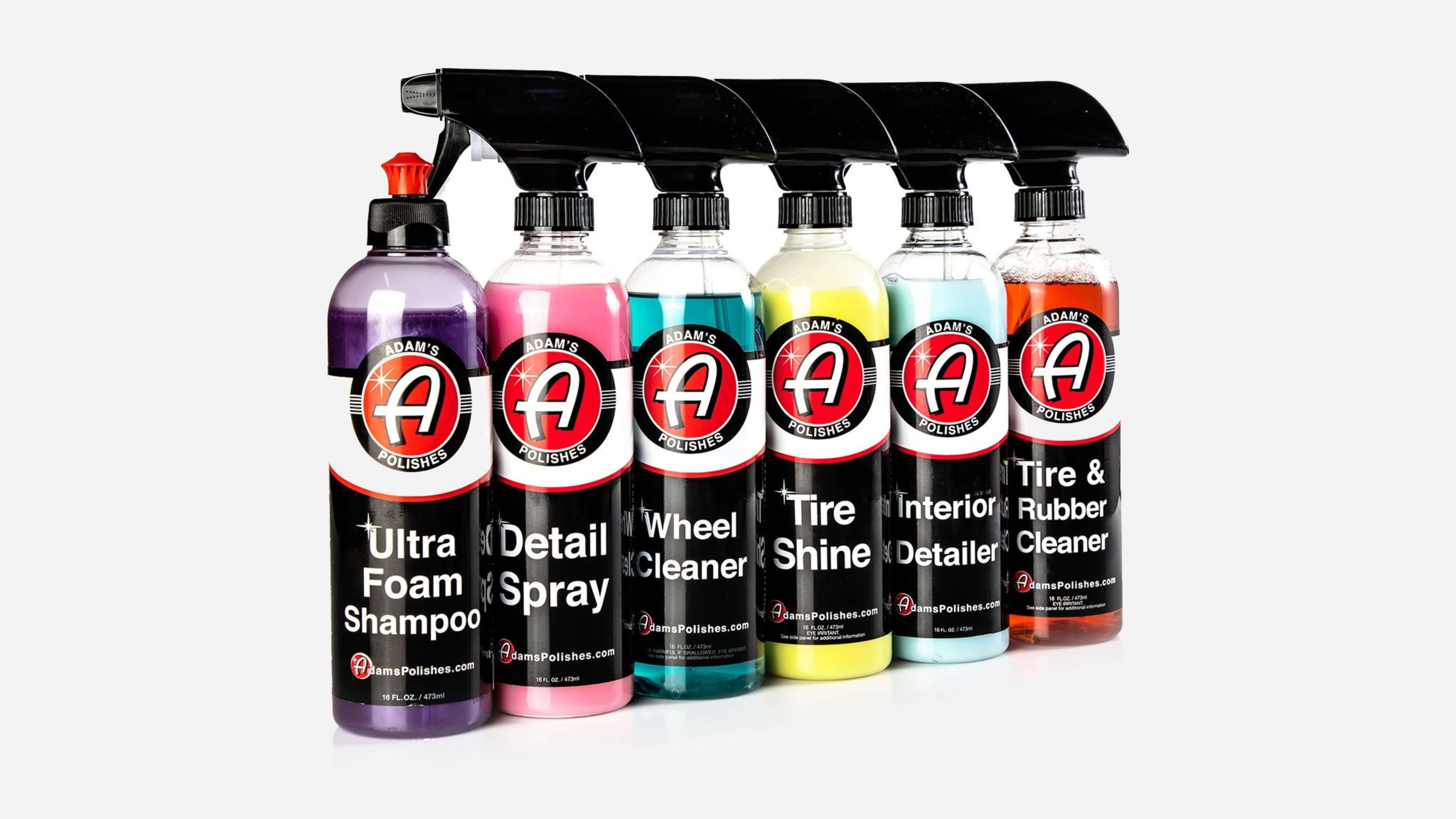 A lineup of six Adam's Polishes car care products, including detailing spray, showcasing vibrant colors and labels for various uses.