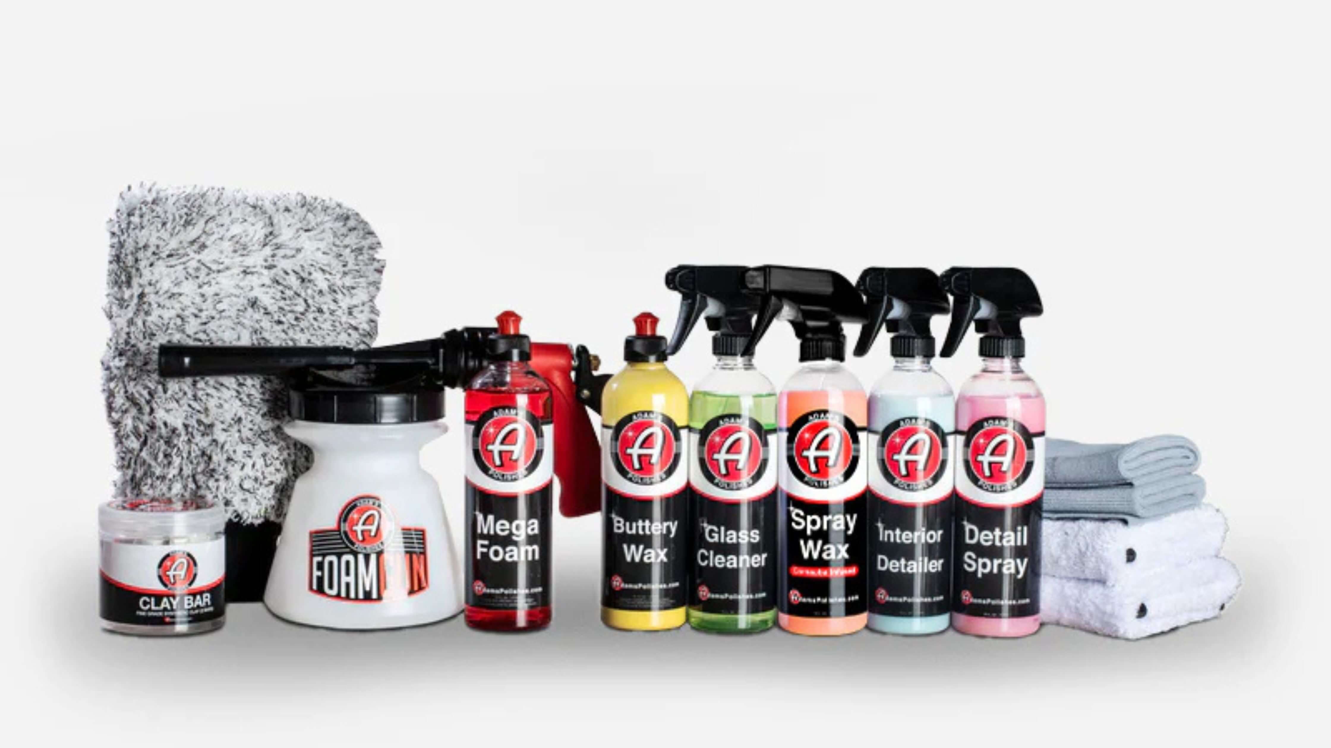 A collection of car detailing products featuring Adam's Polishes quick detailer spray for a brilliant shine.