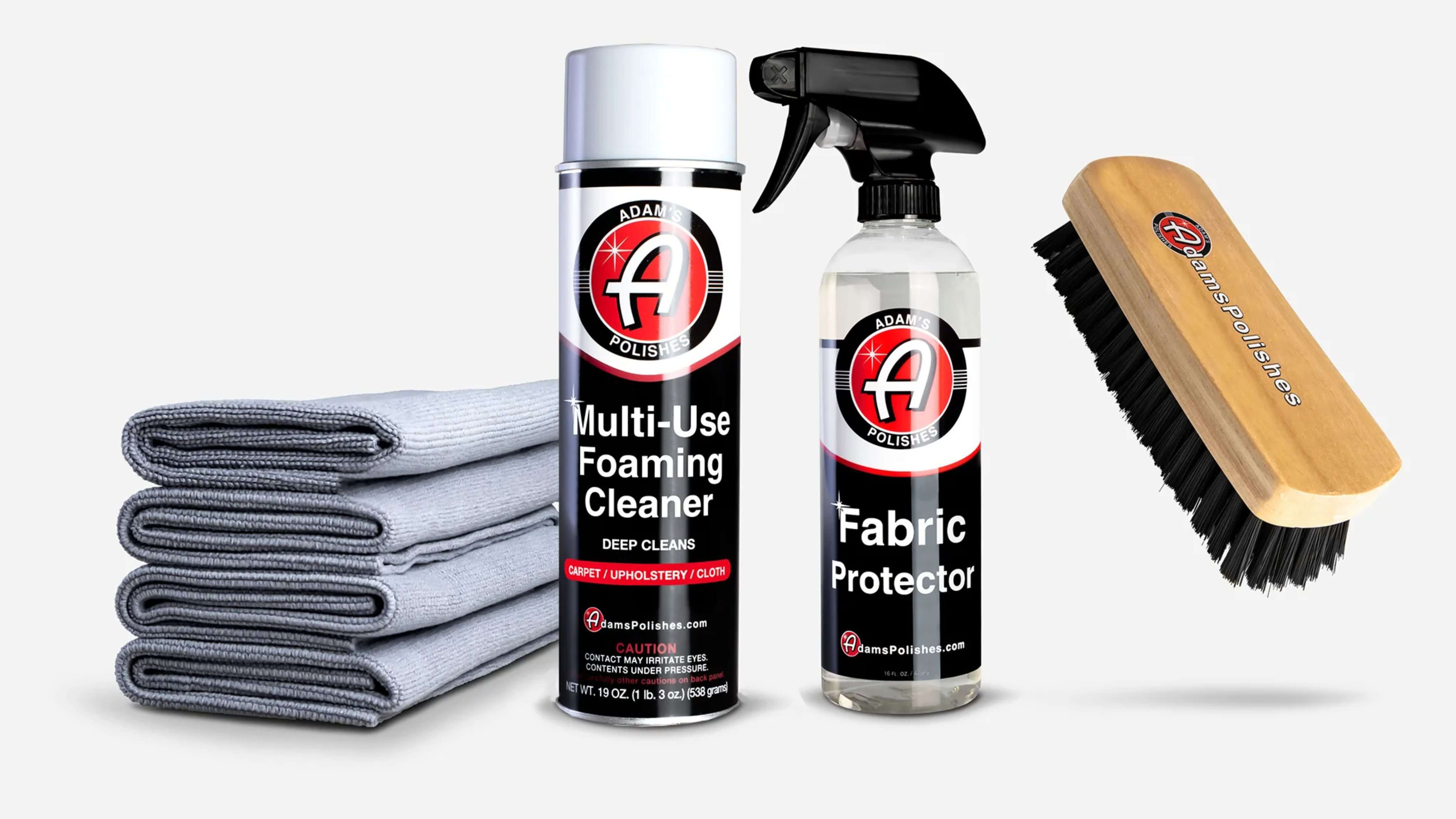 Perfect power wash essentials: foaming cleaner, fabric protector, cloths, and brush.