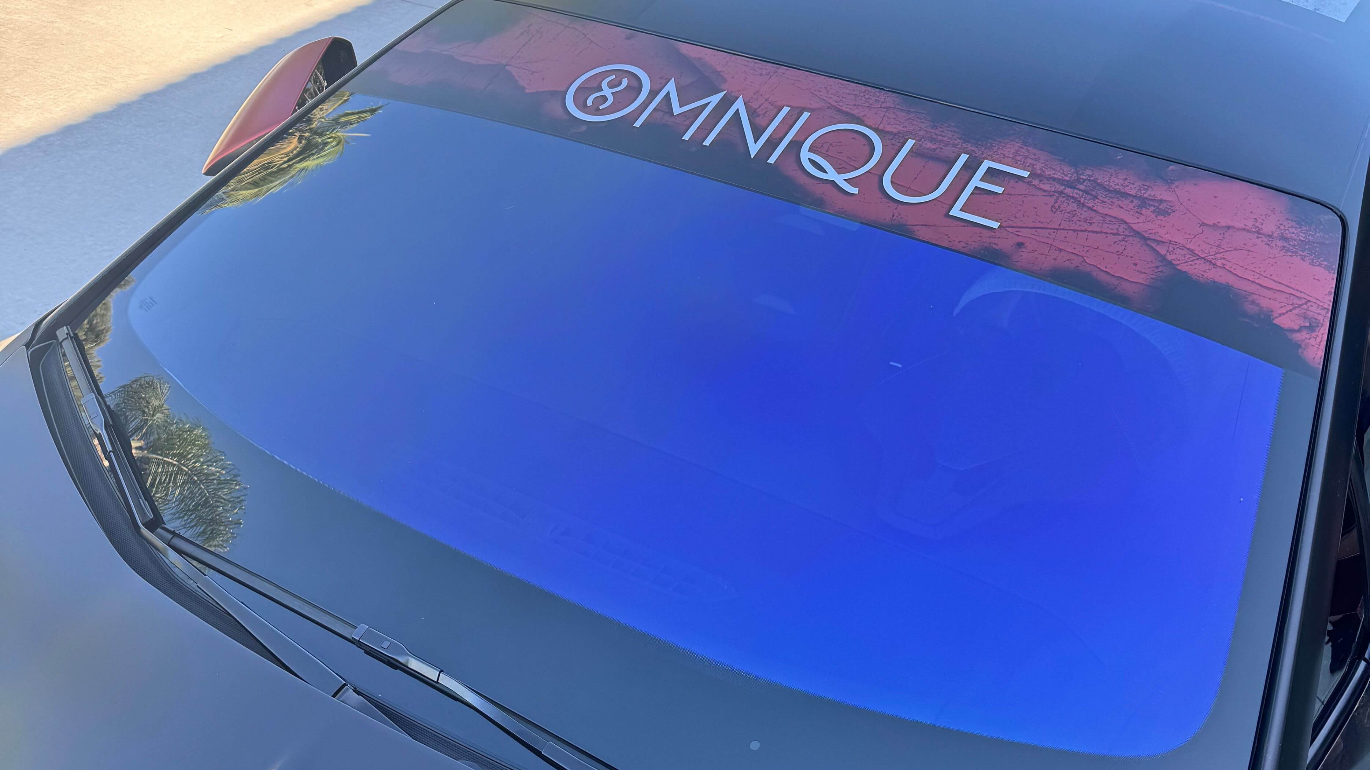 Car window tint removal tools including a hairdryer and razor blade.