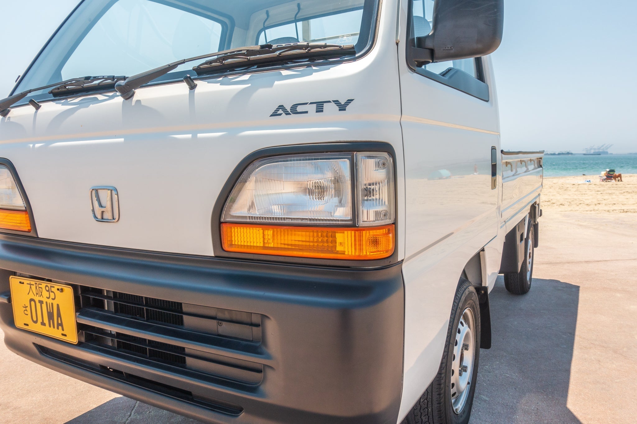 White Honda Acty - front quarter exterior view 