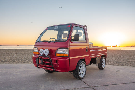 Red Honda Acty Kei Truck Parked on the Beach at Sunset