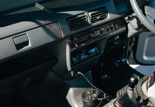 Interior View of a Kei Truck Dashboard and Controls with Gear Shift