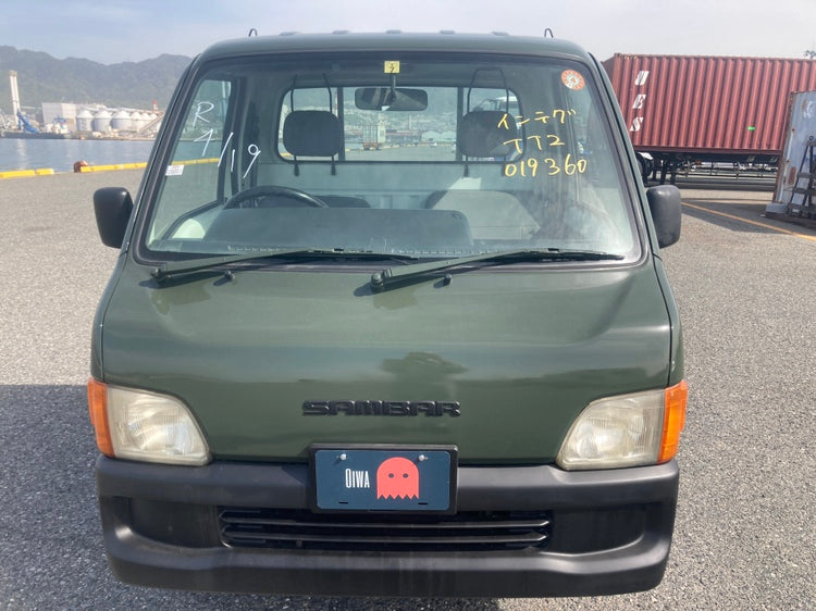 Front view of a Subaru Sambar Kei Truck in green, available for sale through Oiwa Garage. Ideal for US buyers seeking compact, reliable Japanese mini trucks.