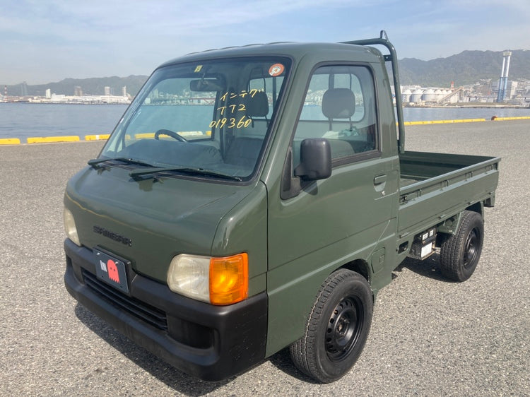 Subaru Sambar Kei Truck in Olive Green for Sale in Colorado, featuring durable off-road capabilities, compact design, and imported directly via Oiwa.co.