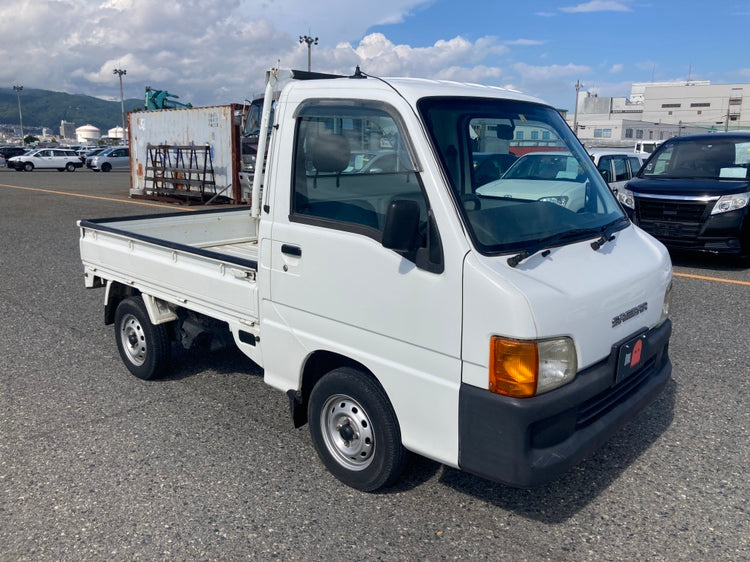 White Subaru Sambar kei truck with a compact design, showcasing its practicality and versatility. Perfect for import to the USA with Oiwa.co and parts from OiwaGarage.co.