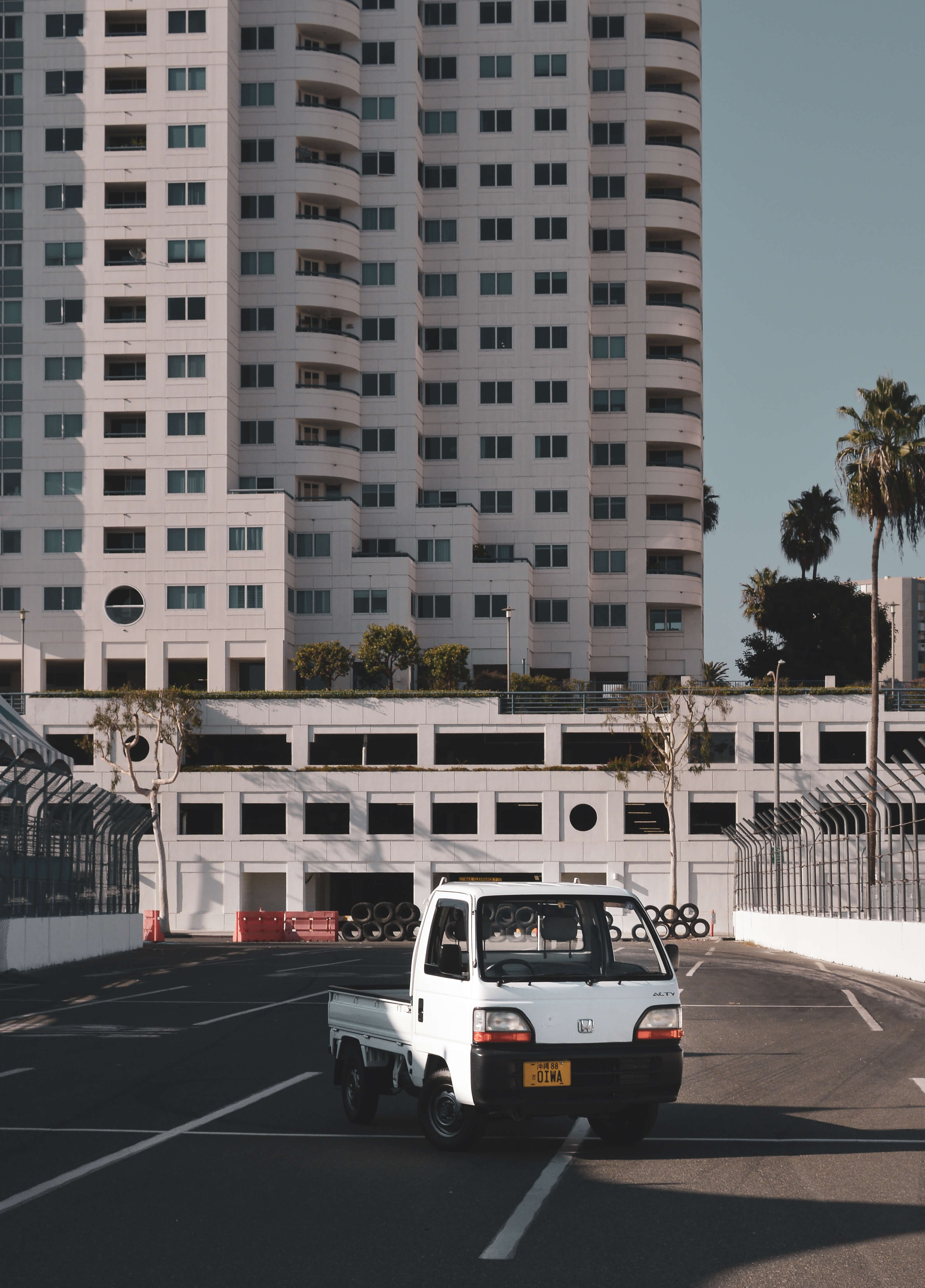 Honda Acty Kei Truck Navigating Urban Race Track - Comparing the Compact Efficiency of Kei Trucks with the Power and Versatility of the Ford F-150.