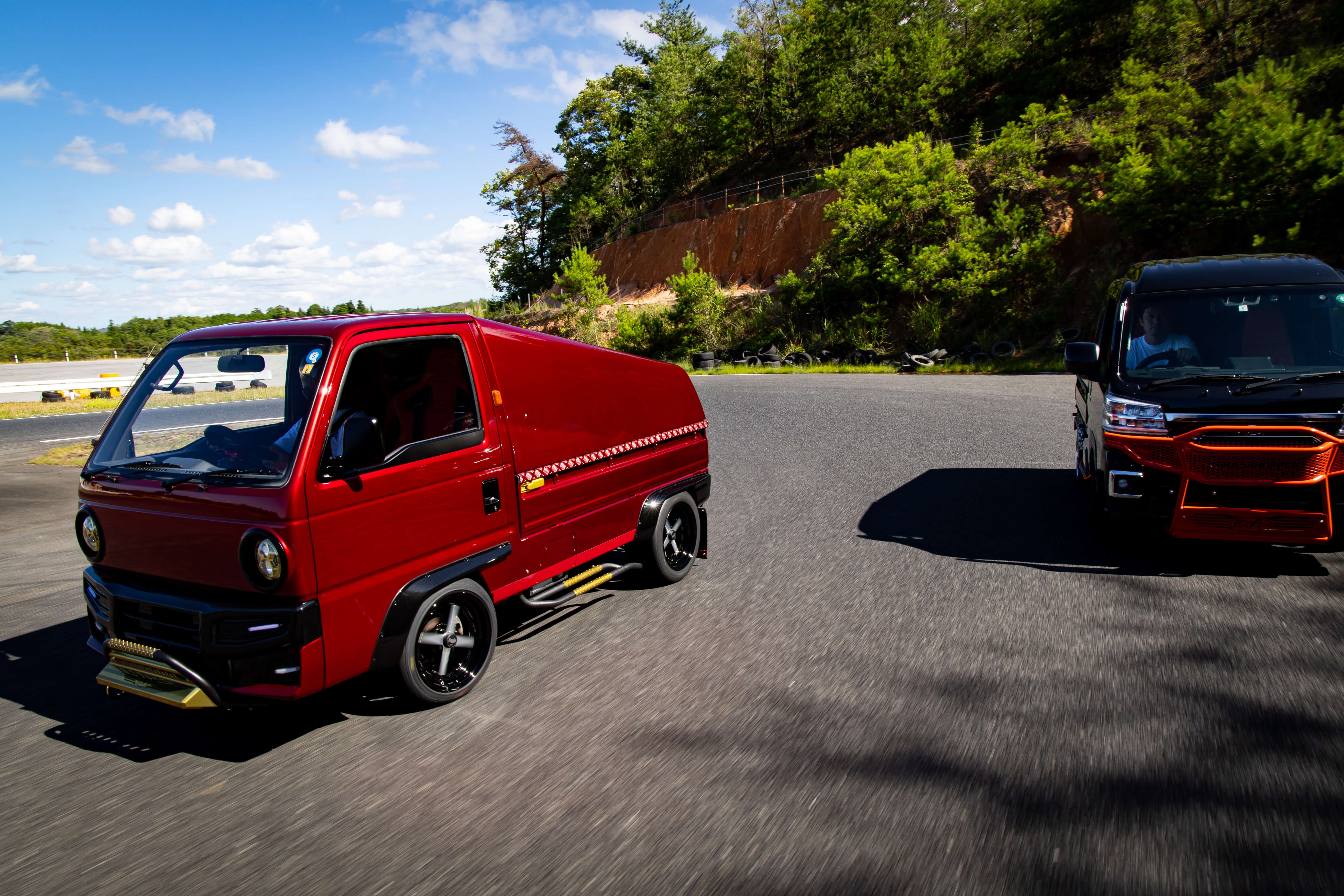 Image showcasing a left hand drive kei truck, highlighting its compact design and appeal for Western roads.