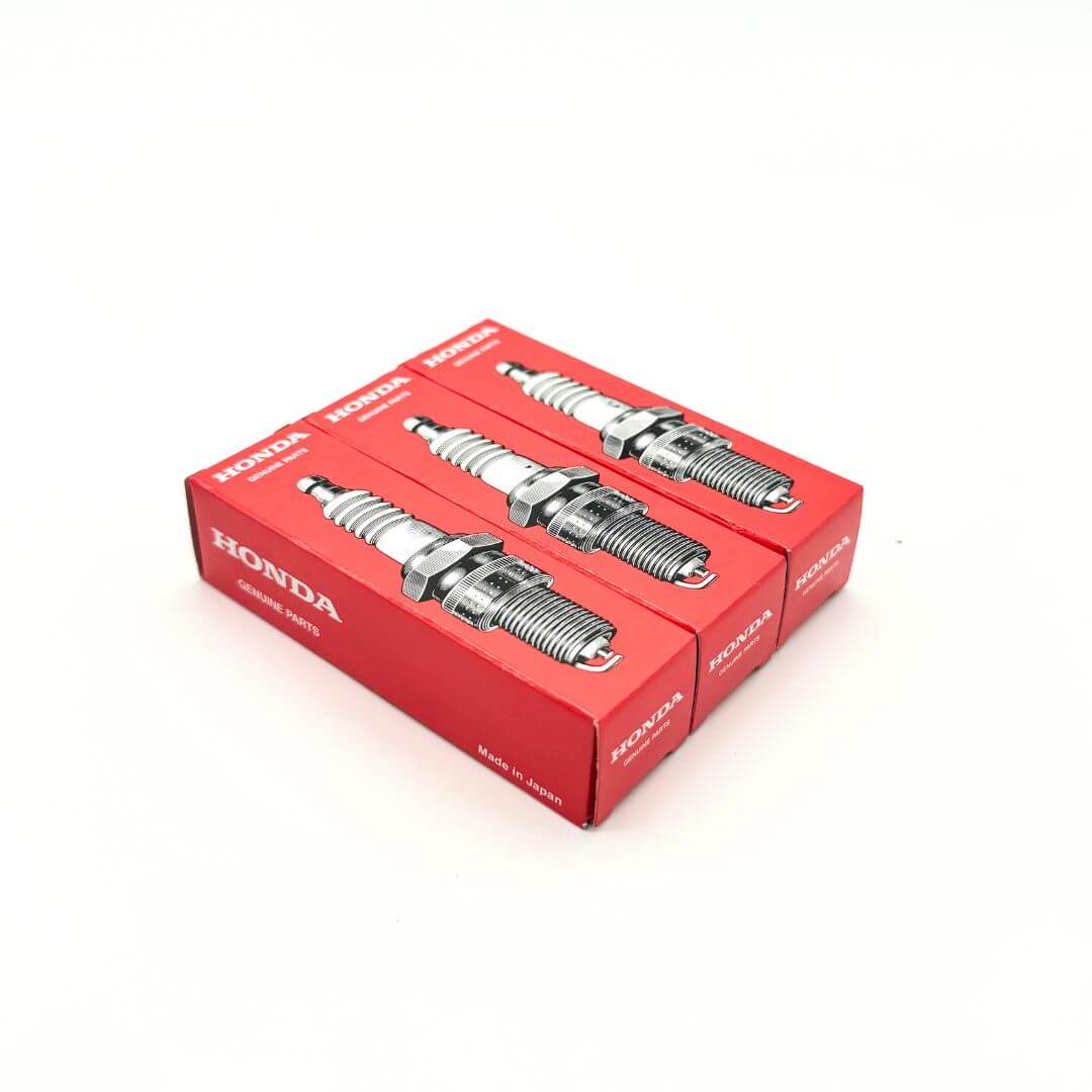 Three boxes of genuine Honda Acty spark plugs, engineered for optimal ignition, improved fuel efficiency, and long-lasting engine performance in Honda’s popular kei truck series.