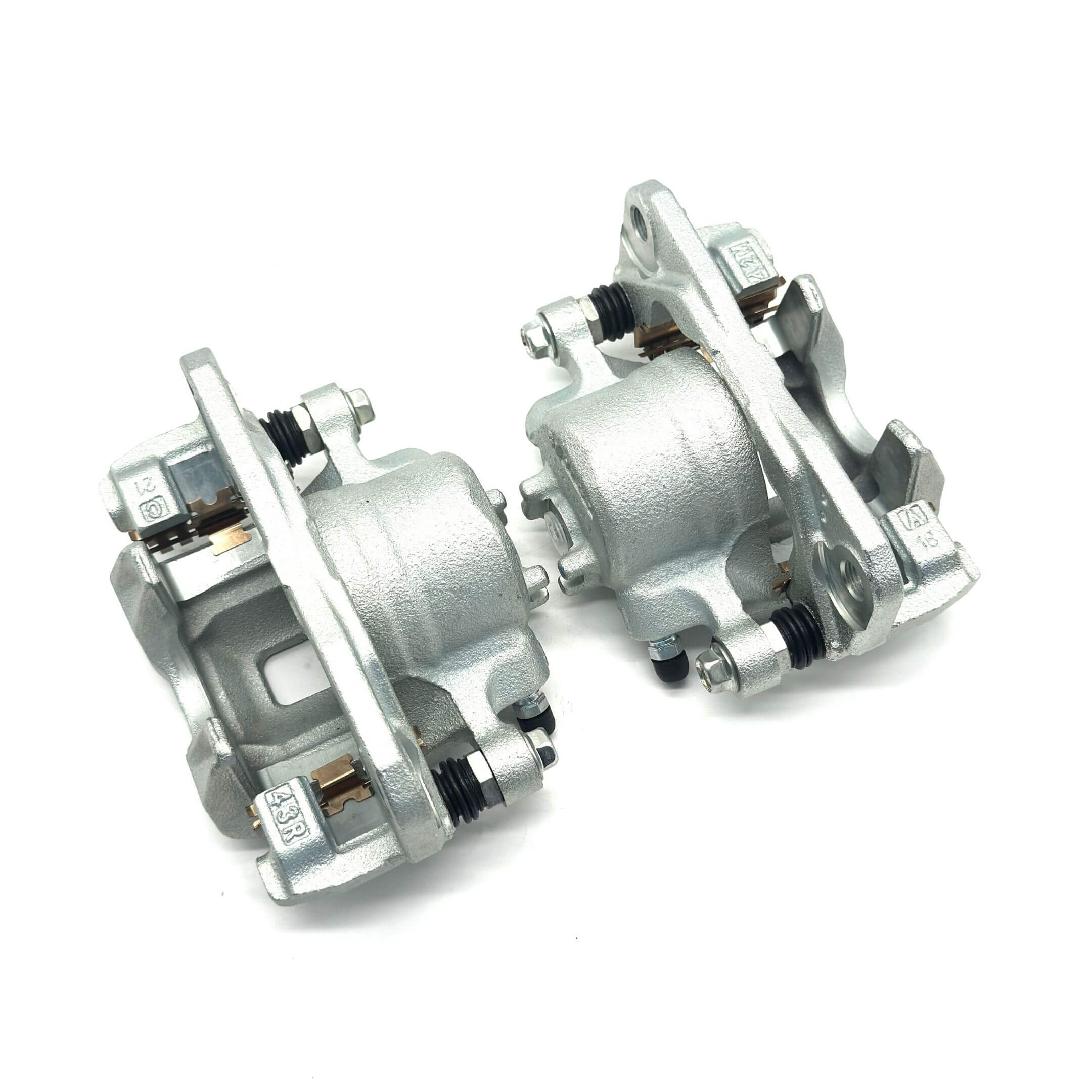 Pair of silver replacement brake calipers for Honda Acty HA6 and HA7 models (1999-2009), providing reliable braking performance and durability.