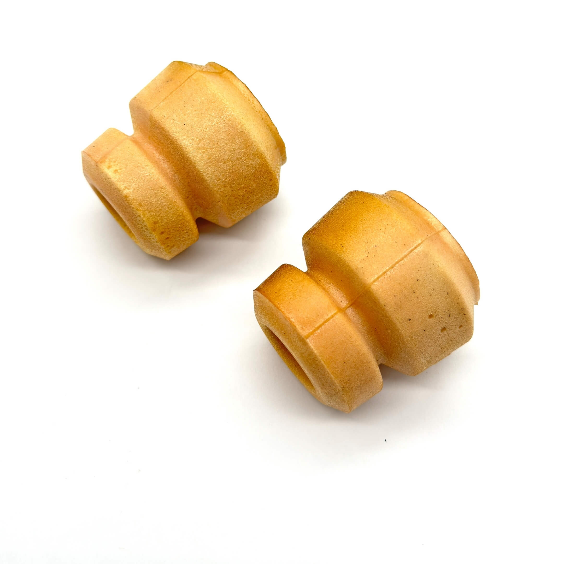 Front strut bump stops for Daihatsu Hijet S100P and S110P models (1994-1999), designed to improve suspension performance and enhance ride comfort in Japanese mini trucks.