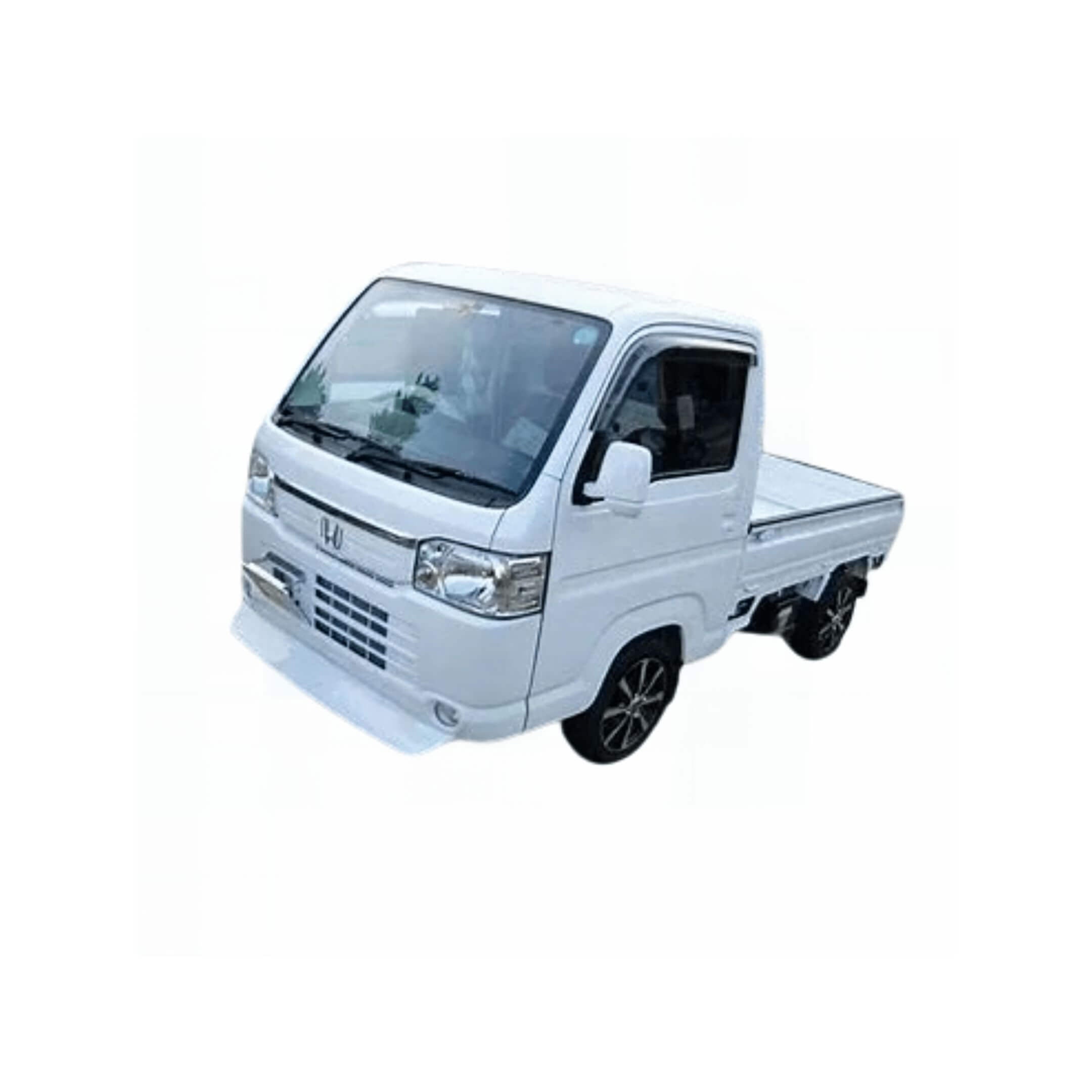 White Honda Acty Truck HA8, HA9 (2009-2022) equipped with a sleek body kit featuring a sporty front bumper, enhanced grille styling, and modern alloy wheels.