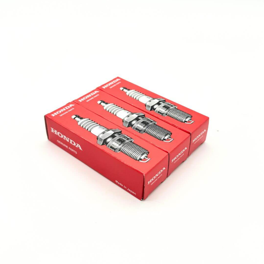 Three Honda Genuine Parts spark plug boxes for Honda Acty Truck HA6, HA7 models from 1999 to 2009, featuring high-quality packaging and Made in Japan label