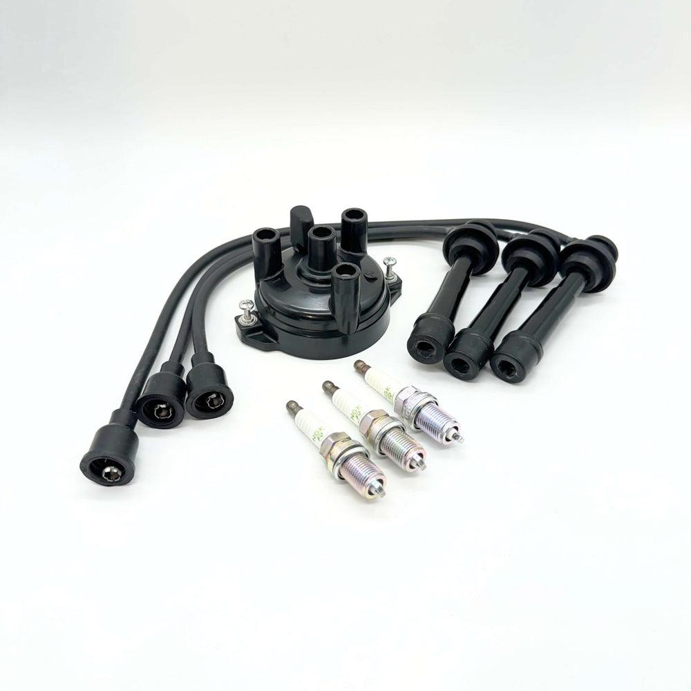 Suzuki Carry Ignition Kit including premium spark plugs, distributor cap, and spark plug wires for DC51T, DD51T, DA52T, DB52T, DA62T, DA63T, DA65T & DA16T (1991-Present)
