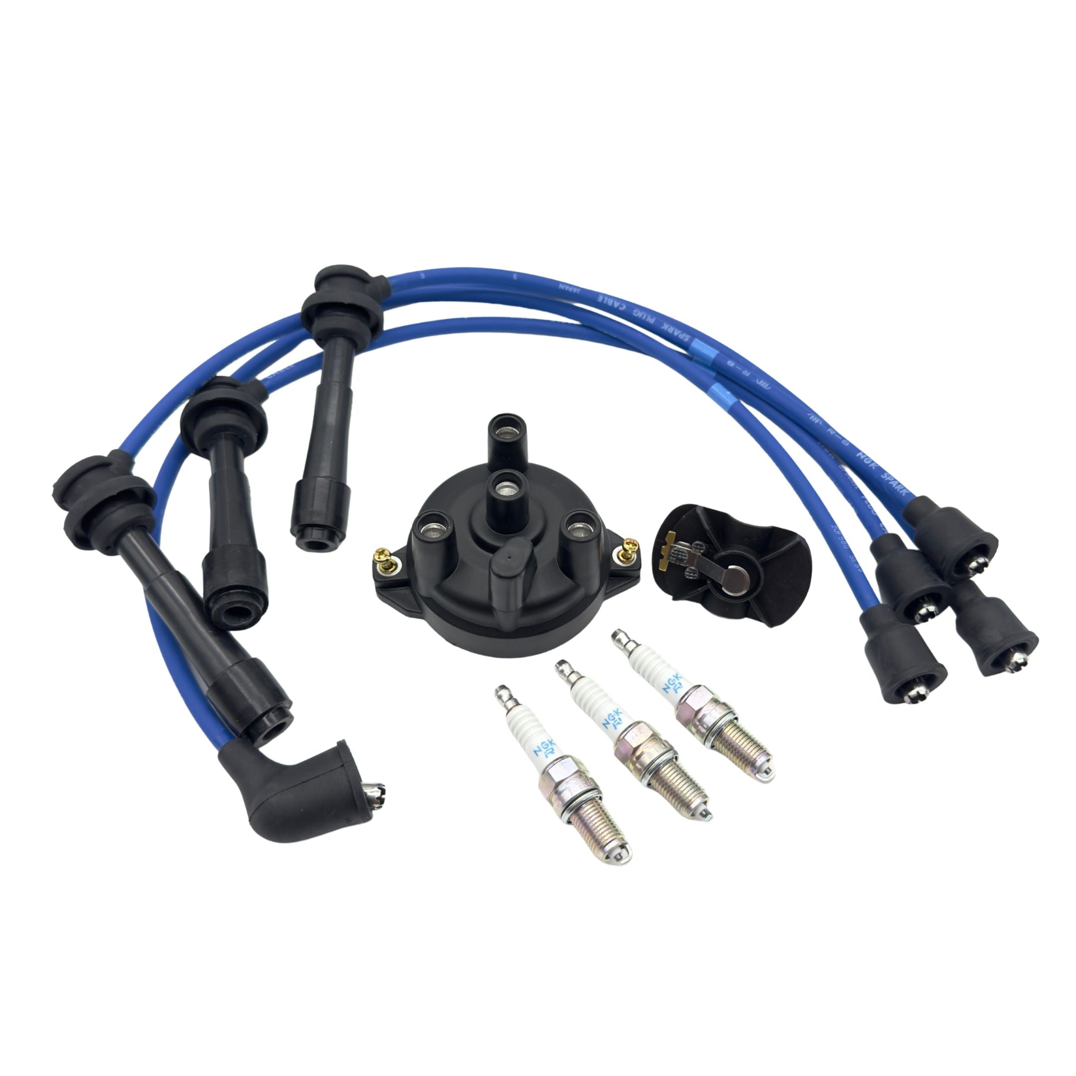 Nine piece ignition kit for Suzuki Carry DC51T and DD51T 1991 to 1999, showing distributor cap, rotor, three NGK spark plugs, and blue spark plug wires arranged on a clean white background for a full ignition system upgrade.