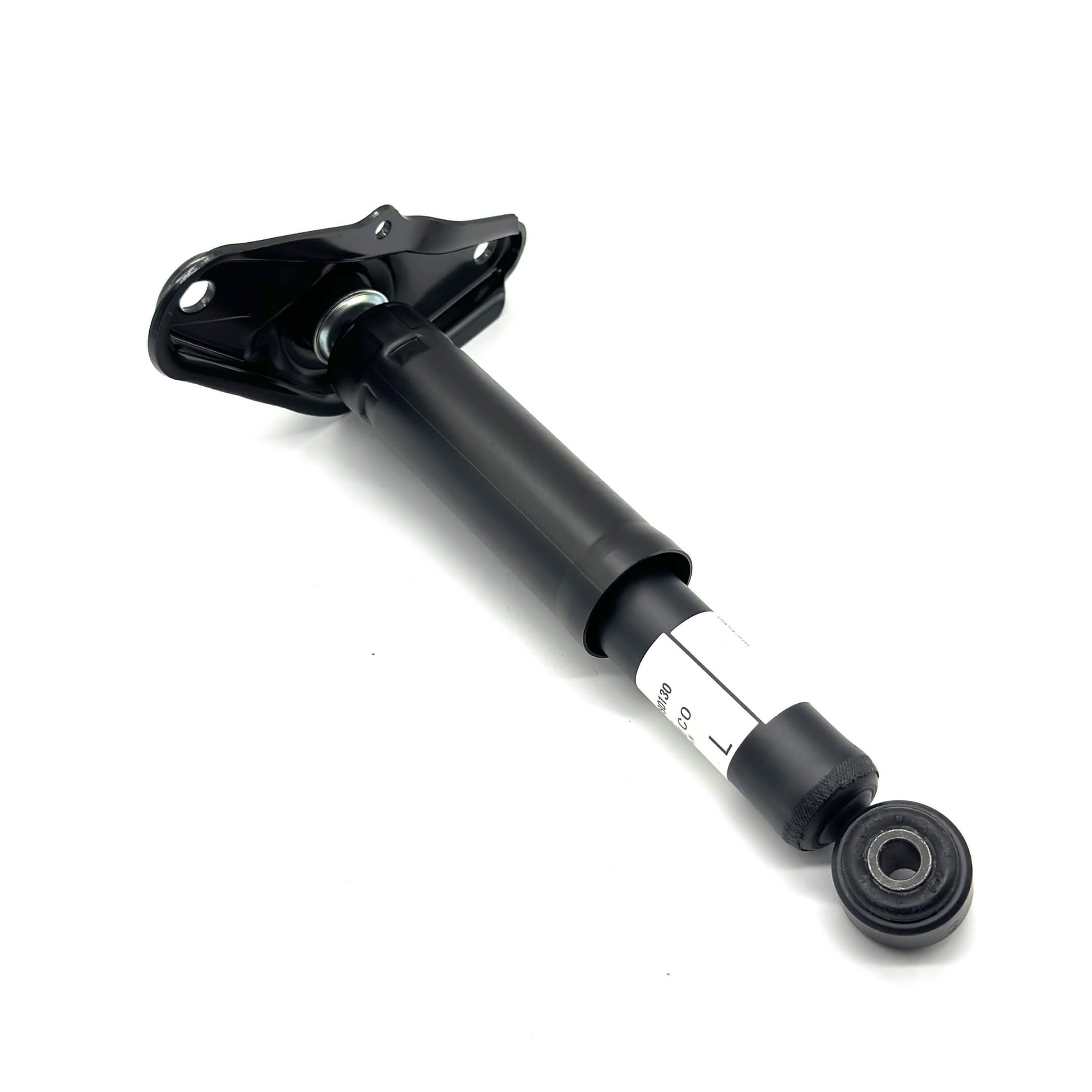 Close-up of rear left shock absorber with durable construction for superior suspension performance.