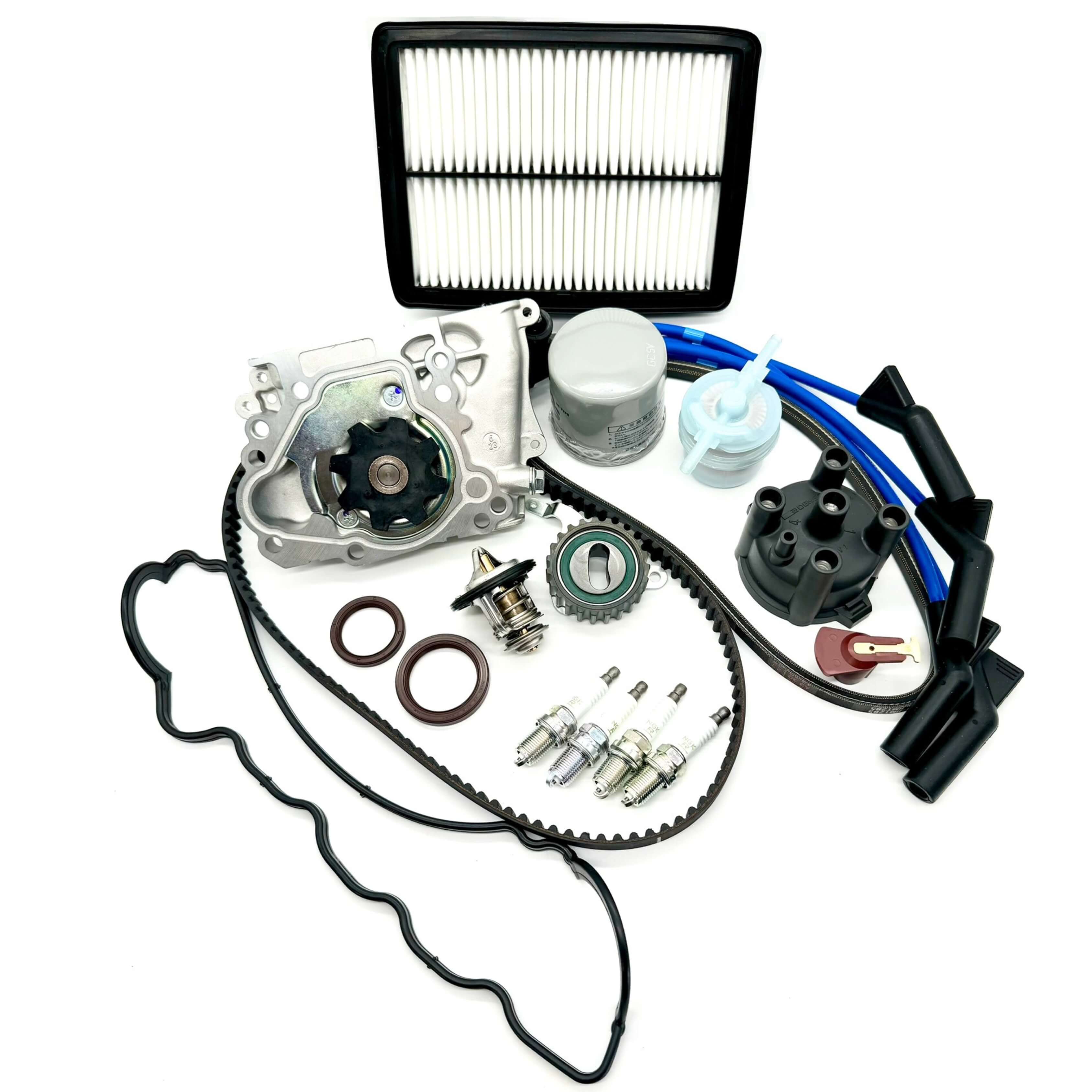 Subaru Sambar KV3 KV4 1990-1998 extensive 21-piece timing belt kit with timing belt, tensioner pulley, cam and crank seals, water pump, alternator belt, thermostat, valve cover gasket, oil, fuel, and air filters, spark plugs, distributor cap and rotor, and spark plug wires for complete engine tune-up and performance enhancement.