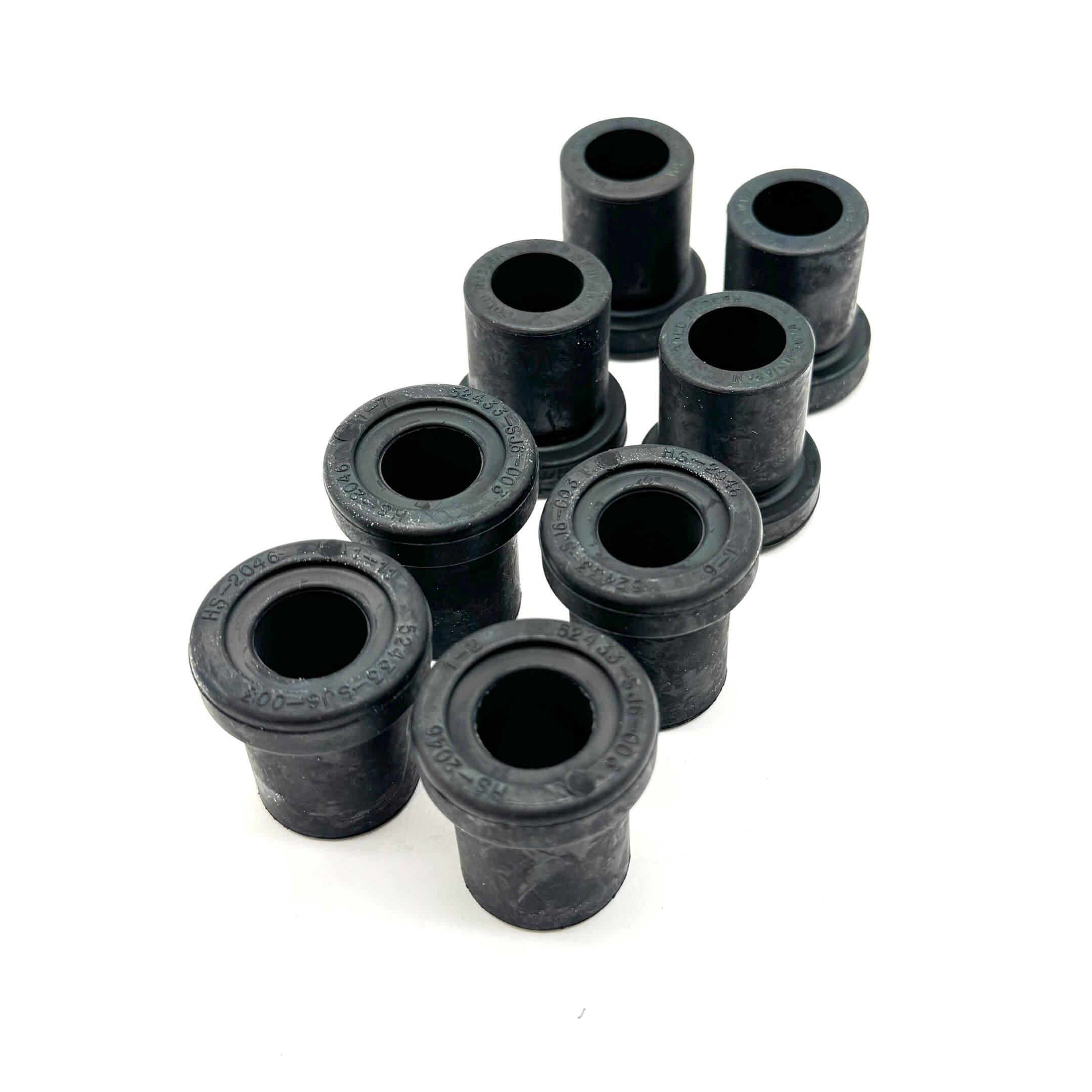 Close-up view of rear spring shackle bushings for Honda Acty Truck HA3, HA4 models (1990-1999), showing durable rubber construction.