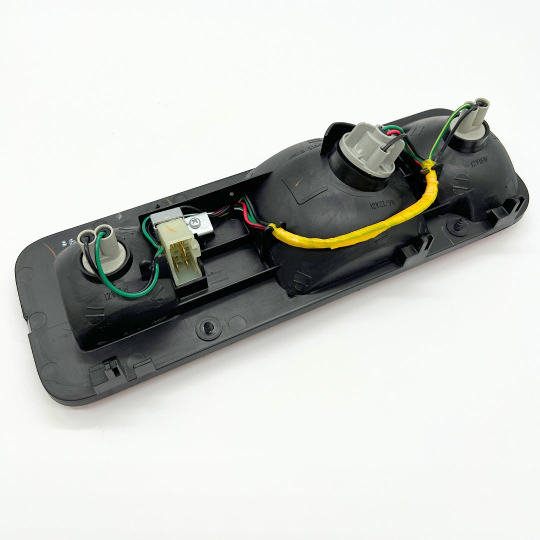 Back view of full tail light assembly kit for left side of Honda Acty Van HH3, HH4 models (1990-1999) - includes wiring and connectors