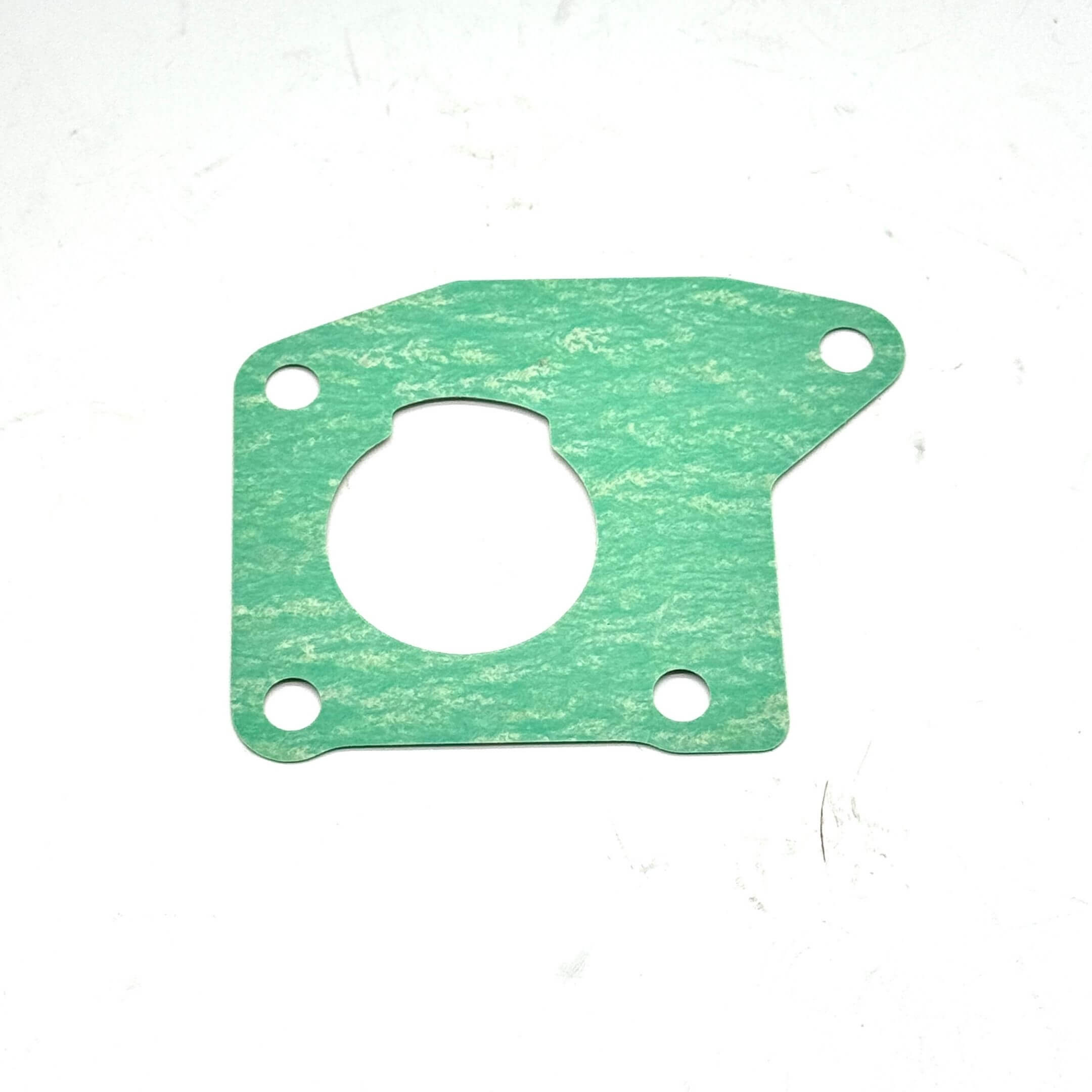 Detailed view of the Honda Acty HA6, HA7 throttle body gasket in green material, ensuring precise fitment.