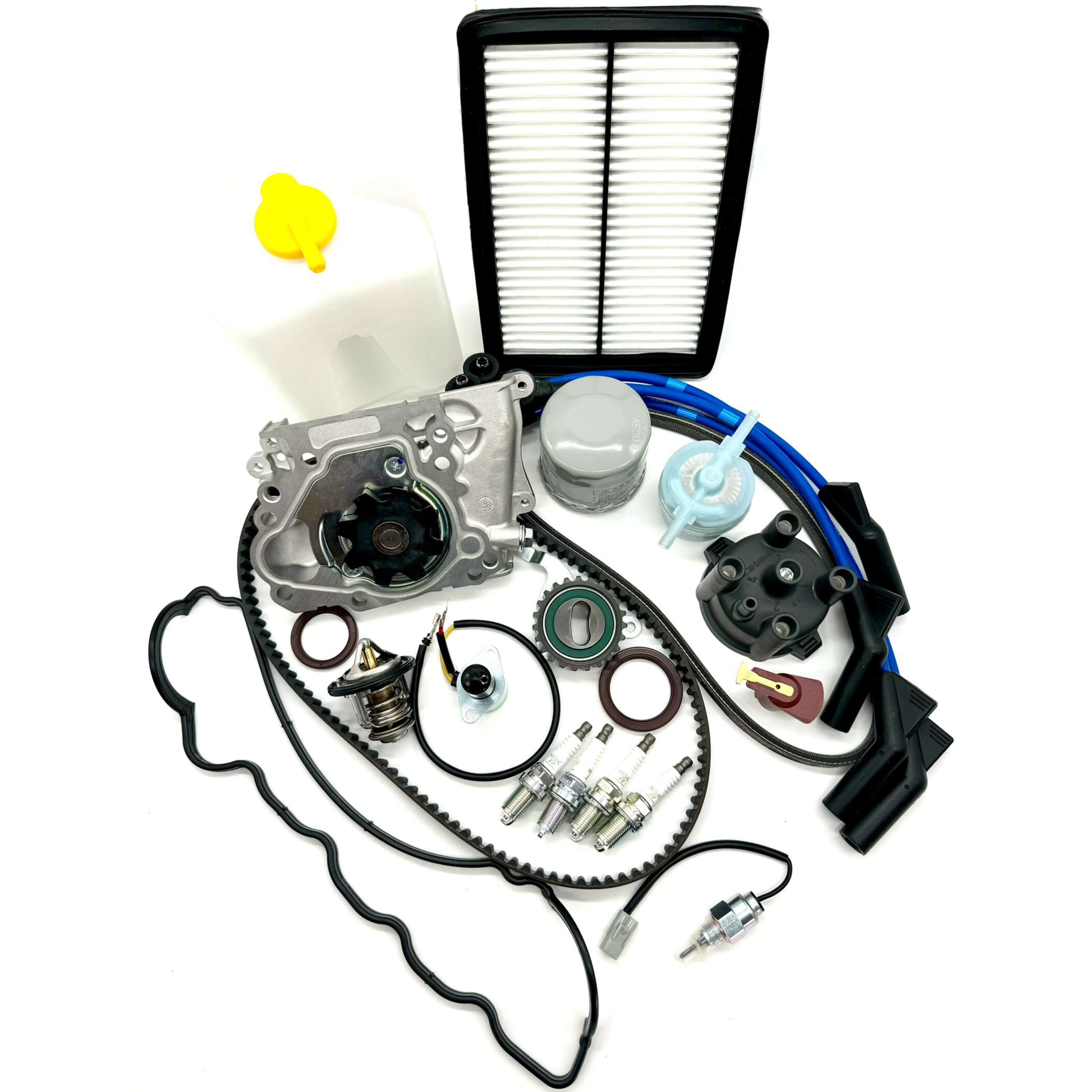 Subaru Sambar 1990-1998 comprehensive 24-piece timing belt kit including timing belt, tensioner pulley, cam and crank seals, water pump, alternator belt, thermostat, valve cover gasket, oil, fuel, air filters, spark plugs, distributor components, spark plug wires, coolant tank, and carburetor solenoids for complete engine maintenance.