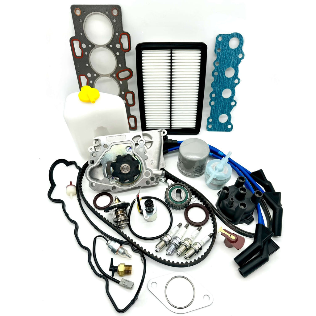 Comprehensive 30-Piece Timing Belt Kit for Subaru Sambar KS3, KS4, 1990-1998: includes high-quality timing belt, seals, tensioner, water pump, gaskets, belts, thermostat, filters, spark plugs, distributor components, coolant tank, solenoid valves, fuel pump, thermo valve, and manifold gaskets.